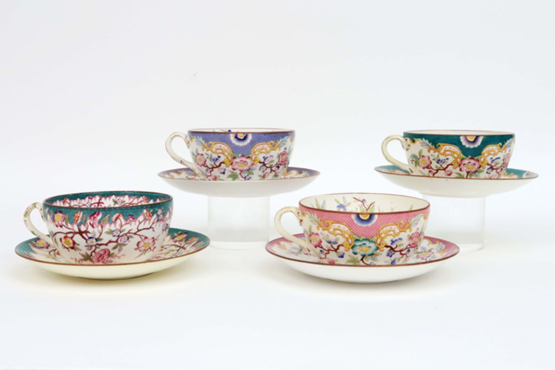 four antique sets of cup and saucer in marked ceramic with a flowers decor||Reeks van 4 antieke - Image 3 of 4