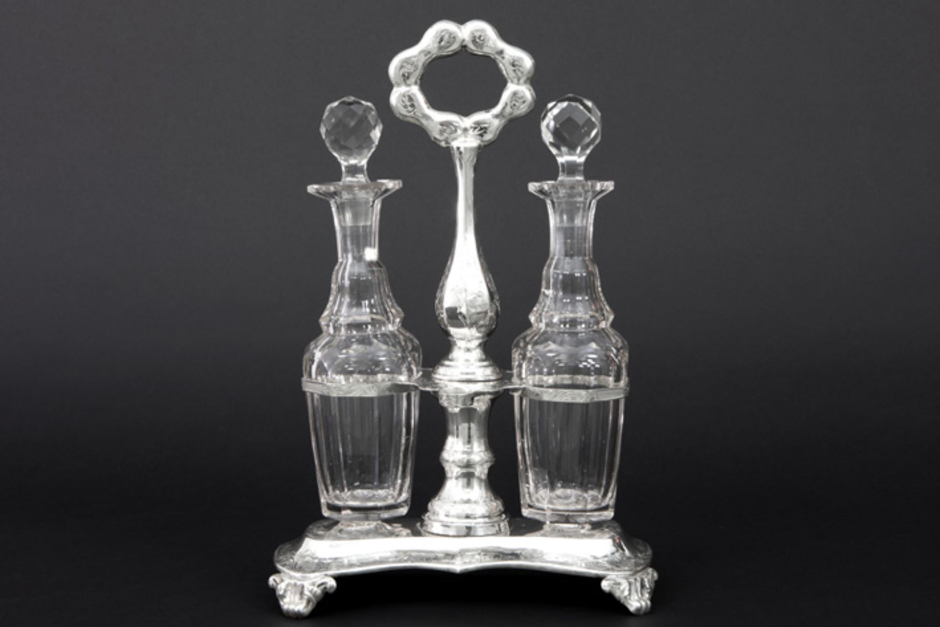 19th Cent. Dutch cruetset in "GMO" marked and 1851 dated silver and with two jugs in crystal||