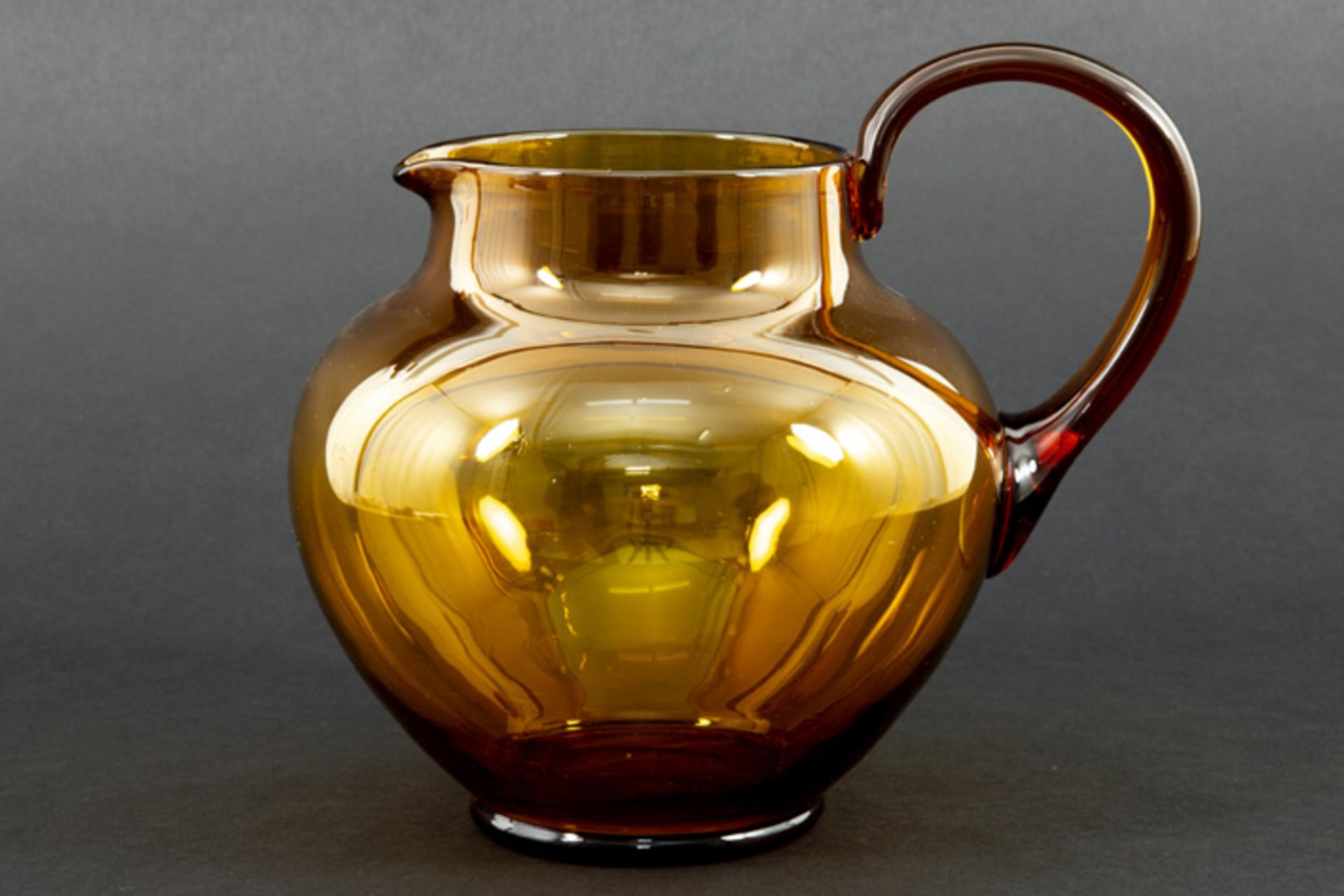 early 20th Cent. Cornelis De Lorm decanter/pitcher (dd 1948) in amber coloured glass dd 1917/19 -