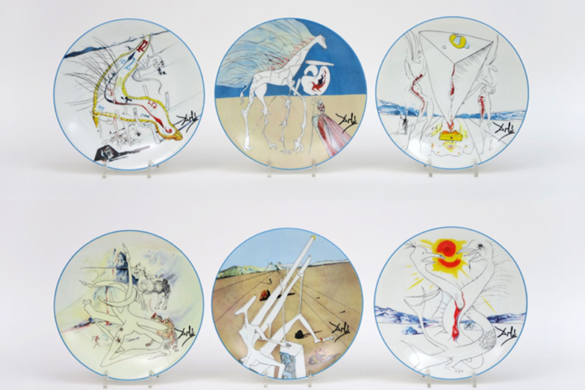 set of five plates in Limoges marked porcelain with representations of Dali's "The Conquest of the C