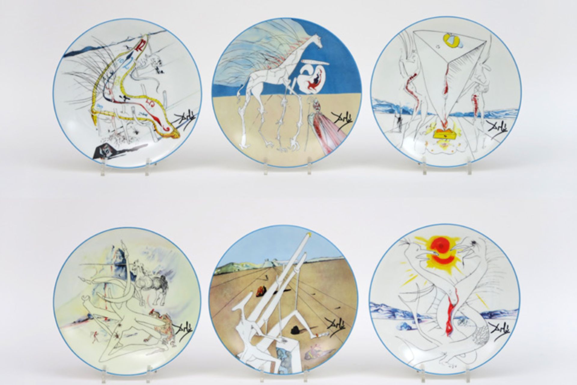 set of five plates in Limoges marked porcelain with representations of Dali's "The Conquest of the