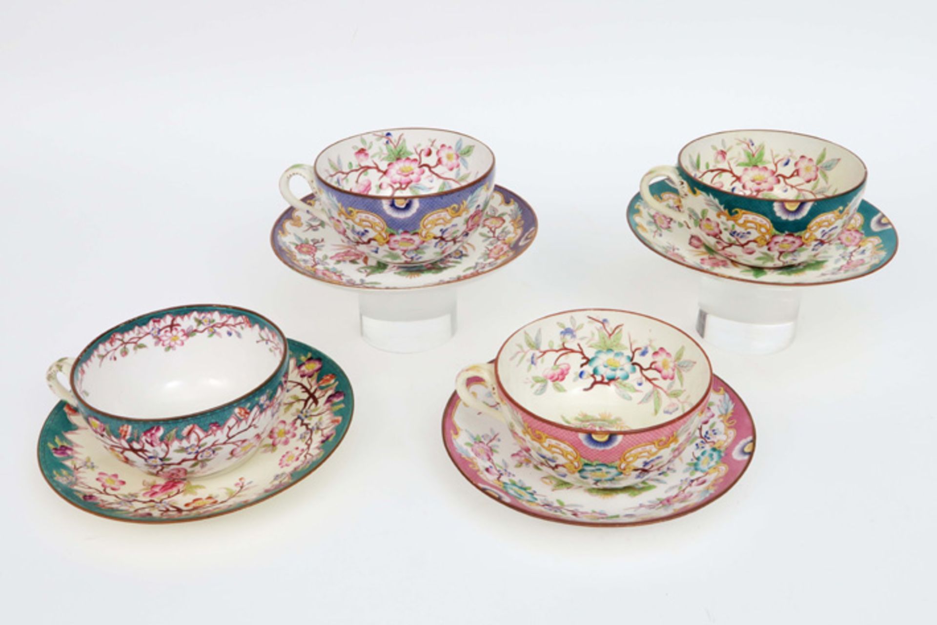 four antique sets of cup and saucer in marked ceramic with a flowers decor||Reeks van 4 antieke - Image 4 of 4