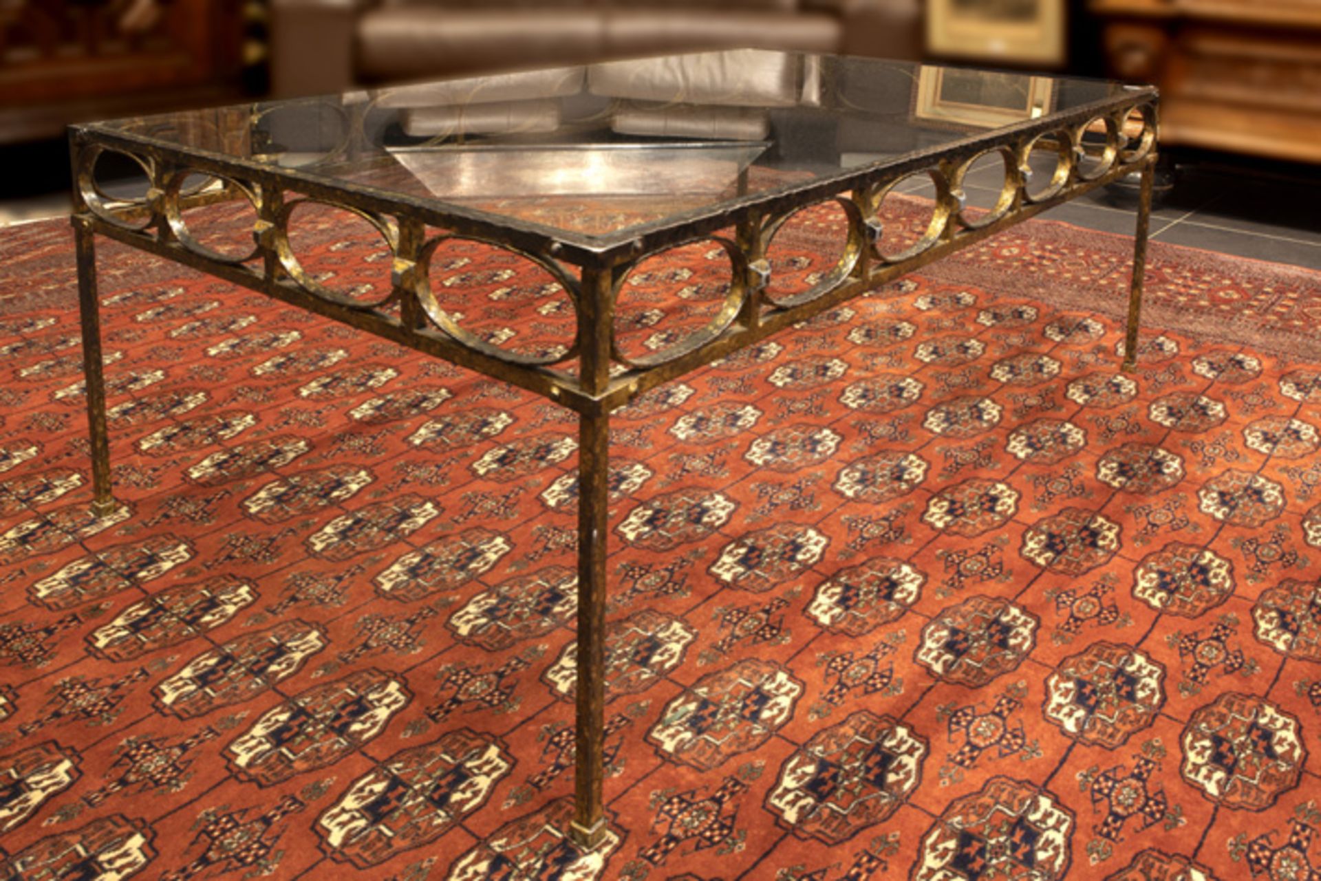 vintage eighties' design fancy table with a rectangular glass top on a base in wrought iron ||