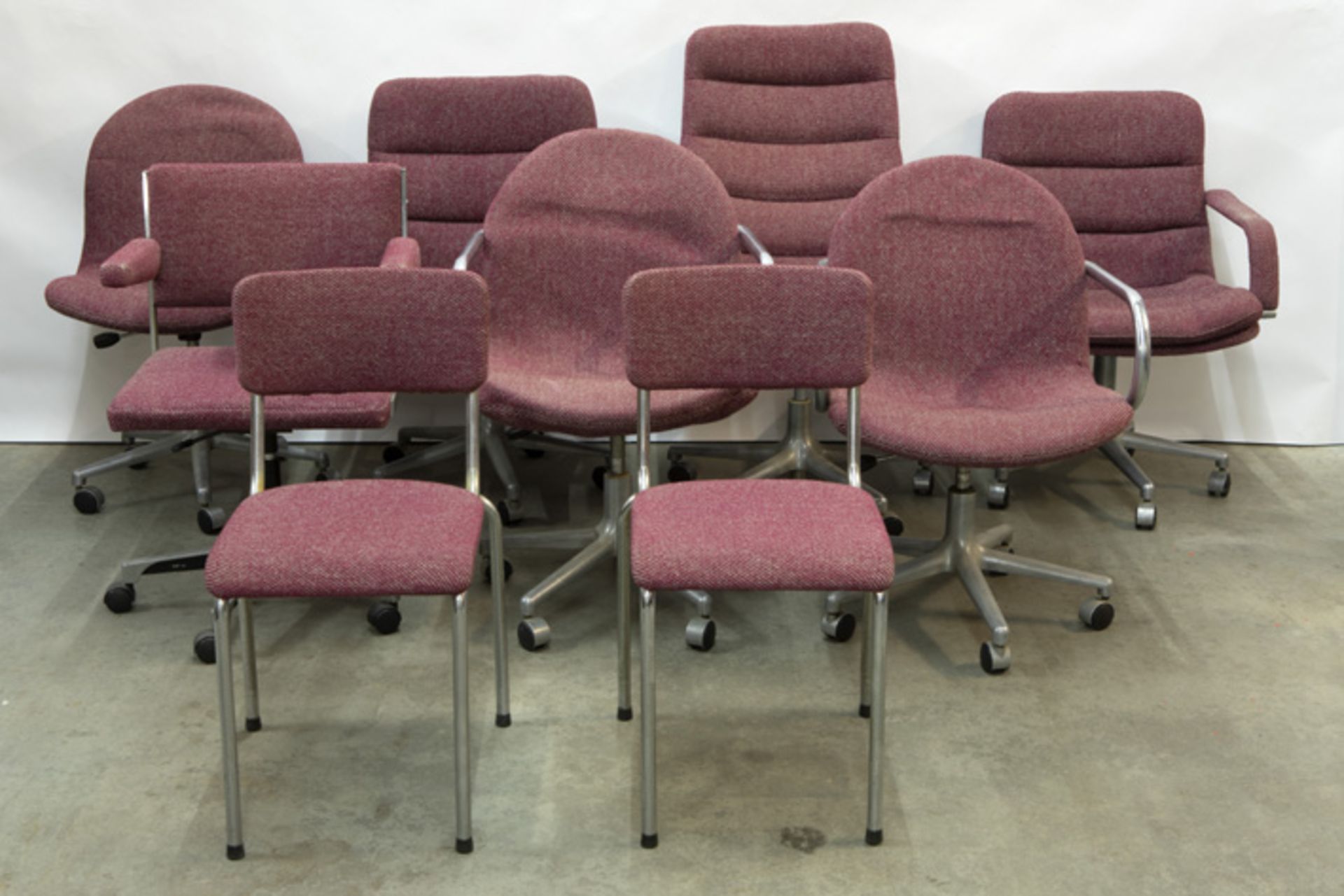 9 sixties' design desk chairs in steel - some are marked "Artifort"