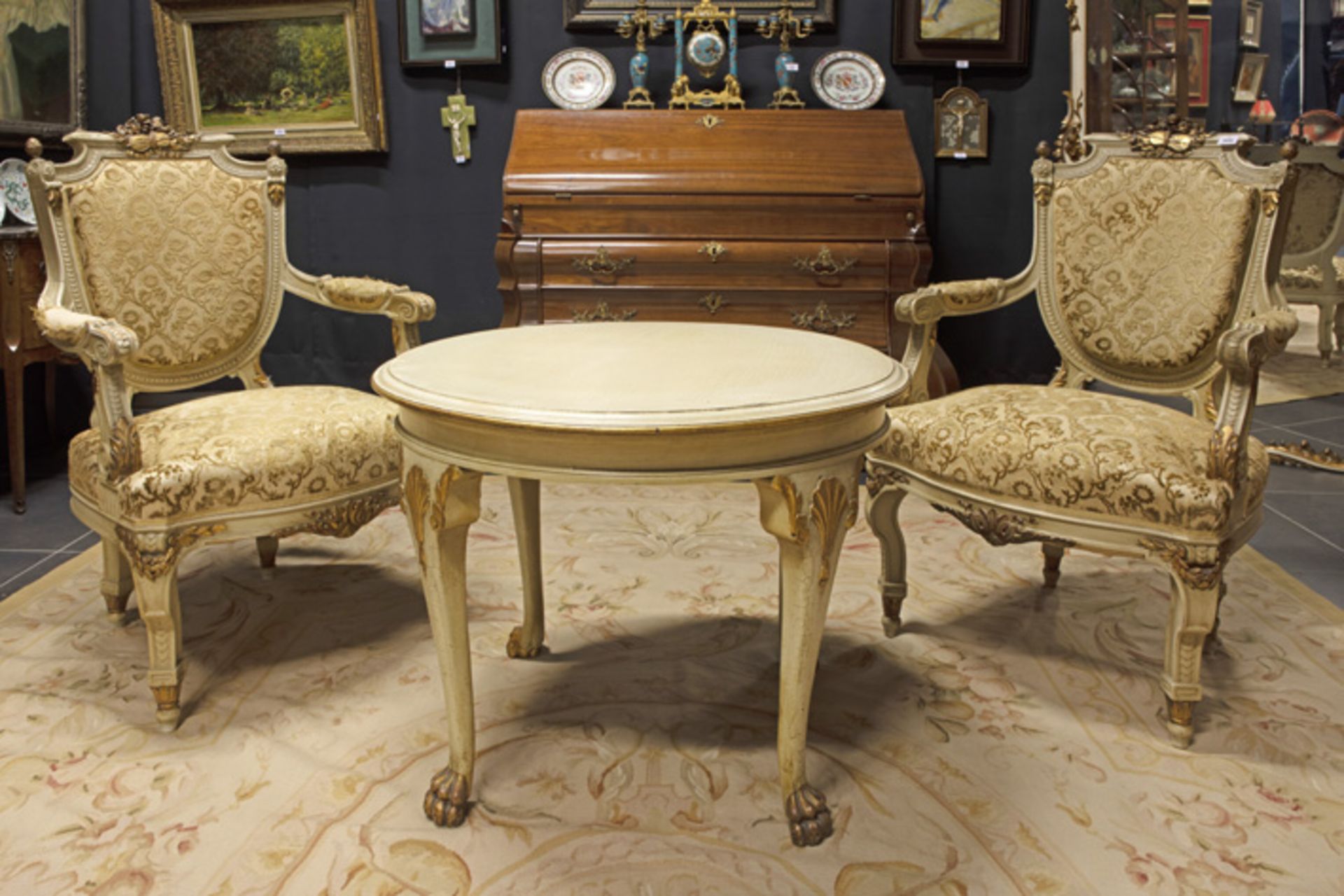 pair of 19th Cent. neoclassical Napoleon III armchairs in polychromed wood sold with a round