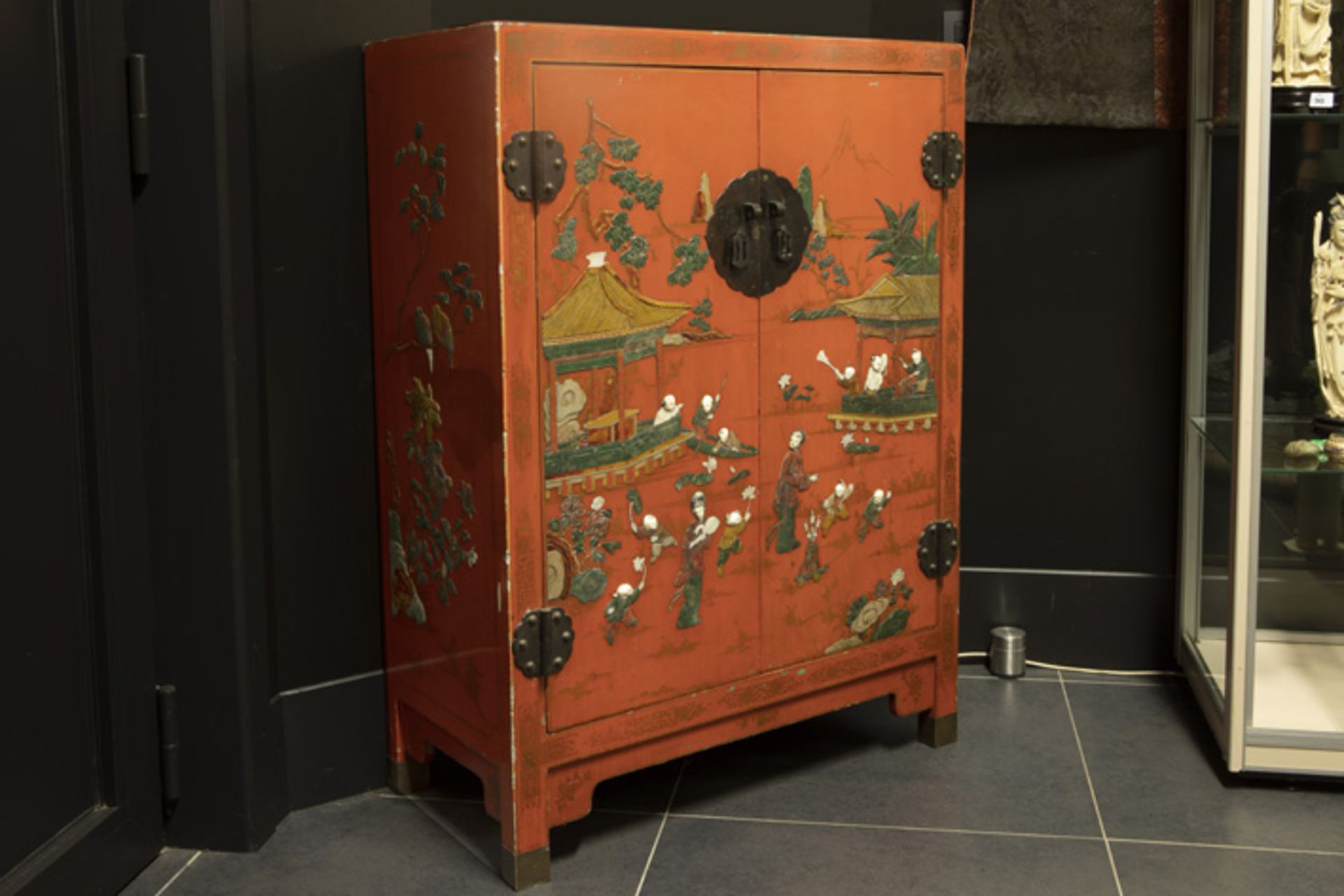 small Chinese two doors cabinet in laquered wood with a polychrome "playing children" decor with - Image 2 of 3