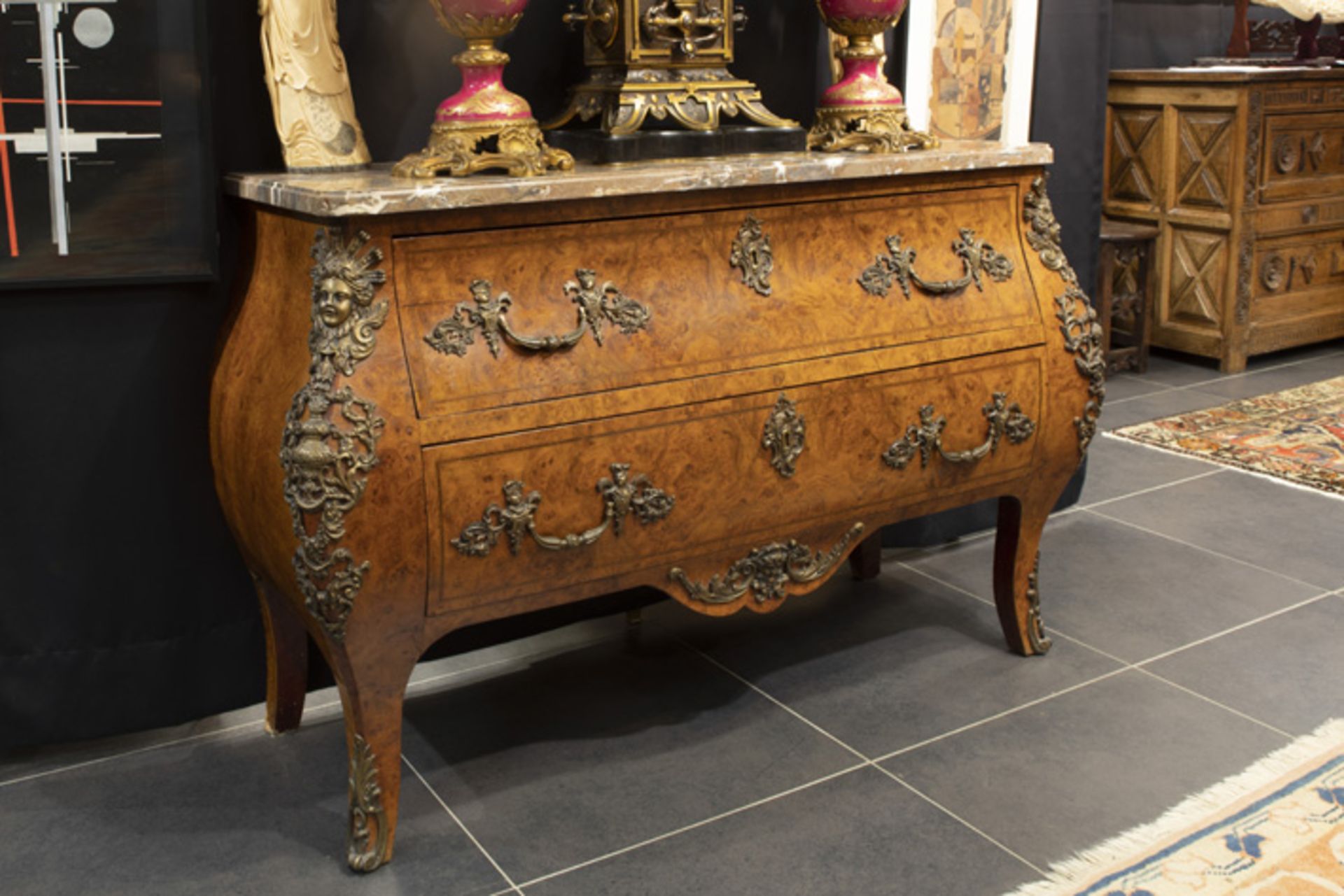 'antique' chest of drawers in burr of walnut with Louis XIV style mountings in bronze and a marble