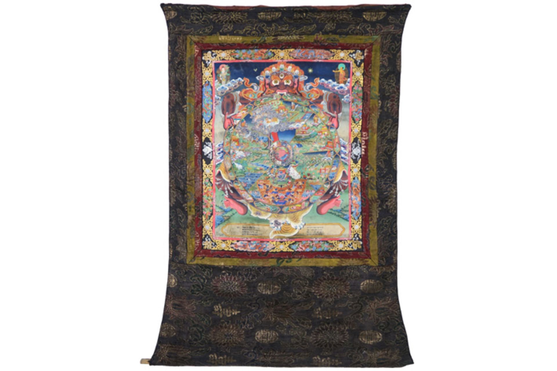 Tibetan tangka with a round "Wheel of life" mandala, protected by Khirtimukha || Tibetaanse tangka