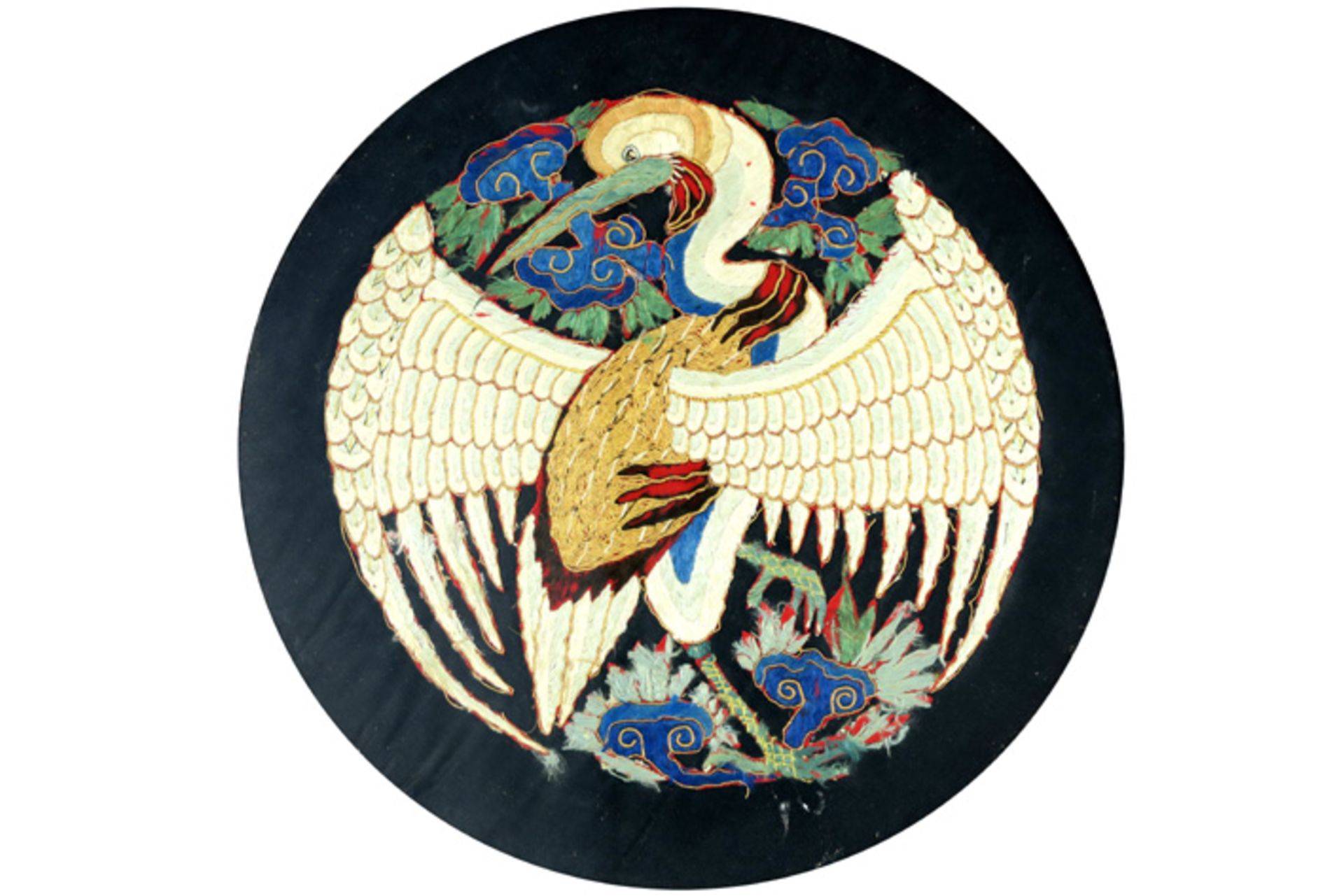 framed round, antique Chinese embroidery, part of a dress, with the representation of a phoenix ||