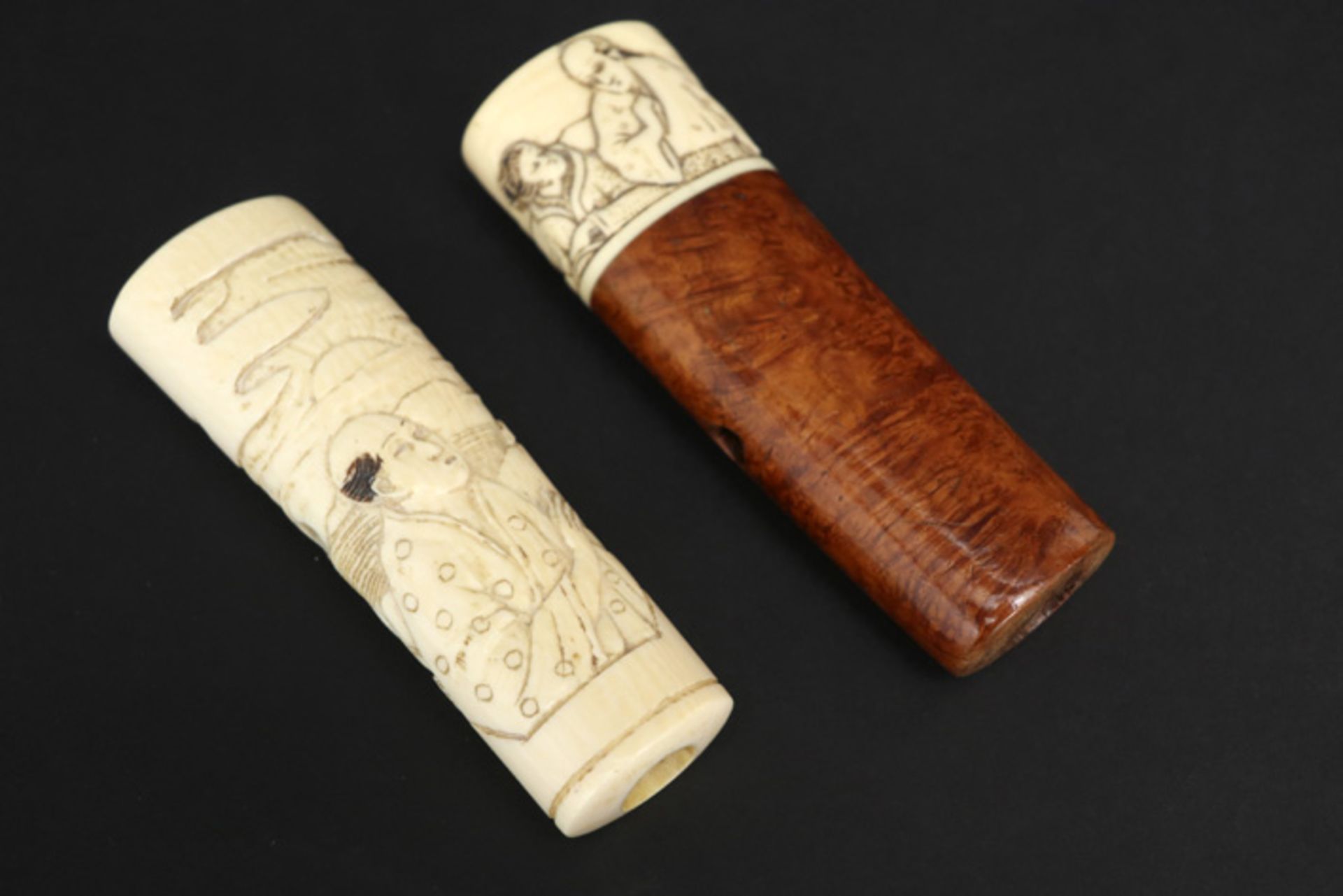 two umbrella grips, one in burr wood and ivory & one in ivory (Japanese work) || Twee grepen van