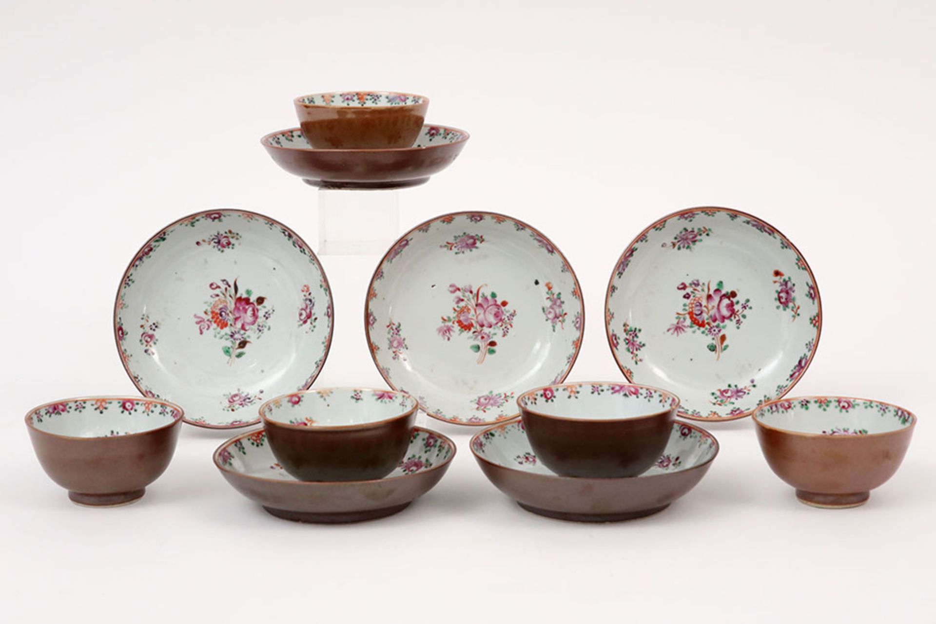 series of five 18th Cent. Chinese sets of cup and saucer in capuchin brown porcelain with 'Famille