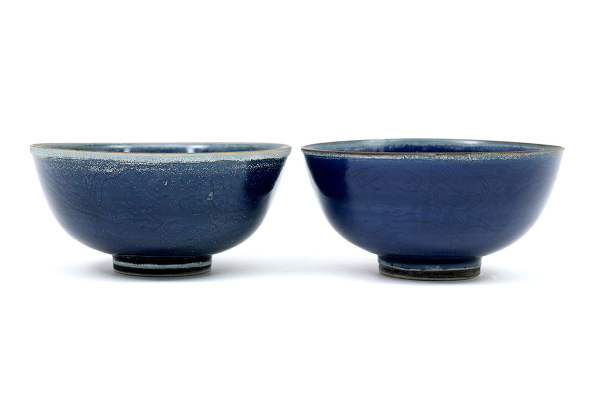 pair of 17th Cent. Chinese bowls in porcelain with a powder-blue glaze and each with a label of