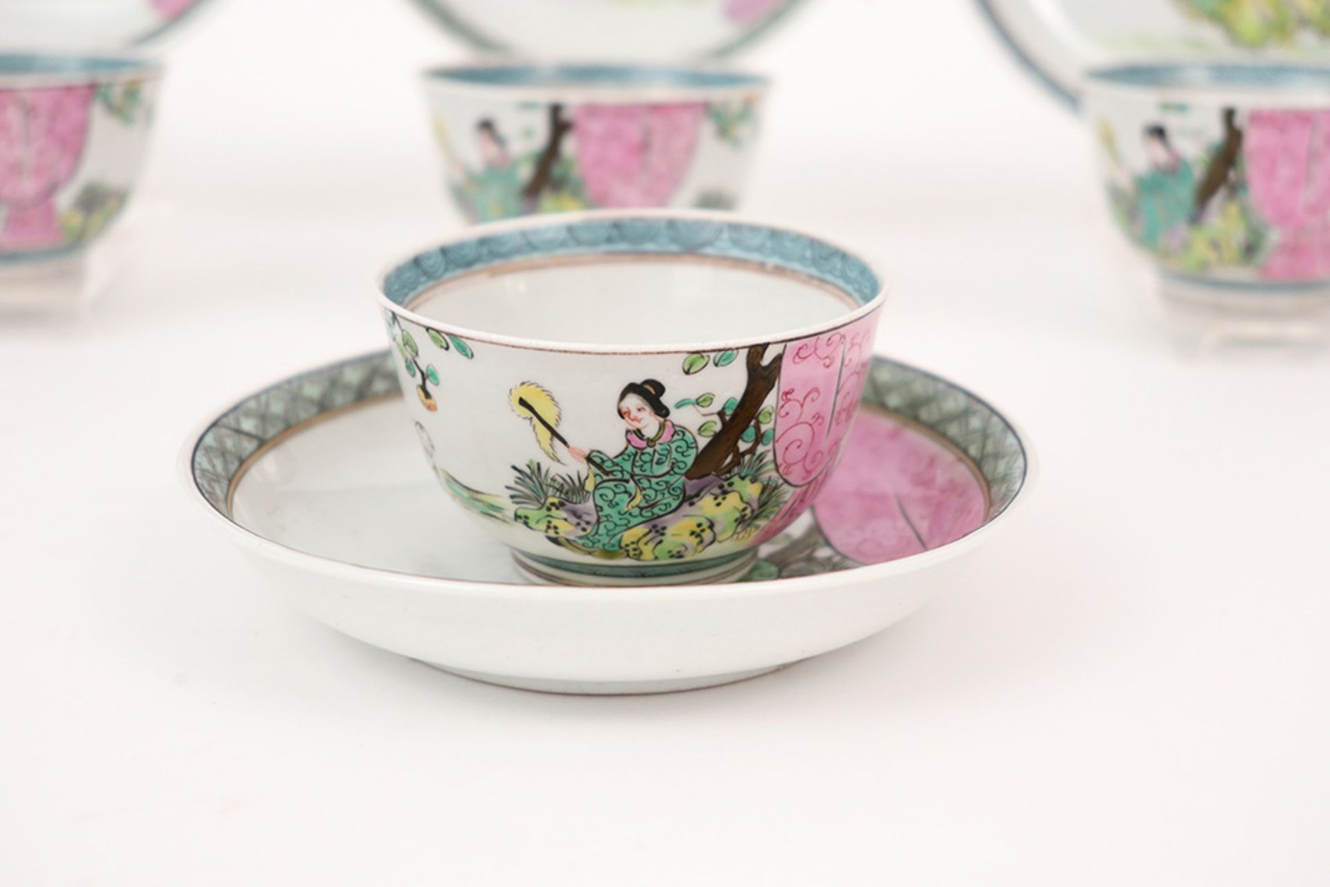 antique set of four cups and five saucers in porcelain with 'Famille Rose' decor with lady and dog - Image 2 of 4