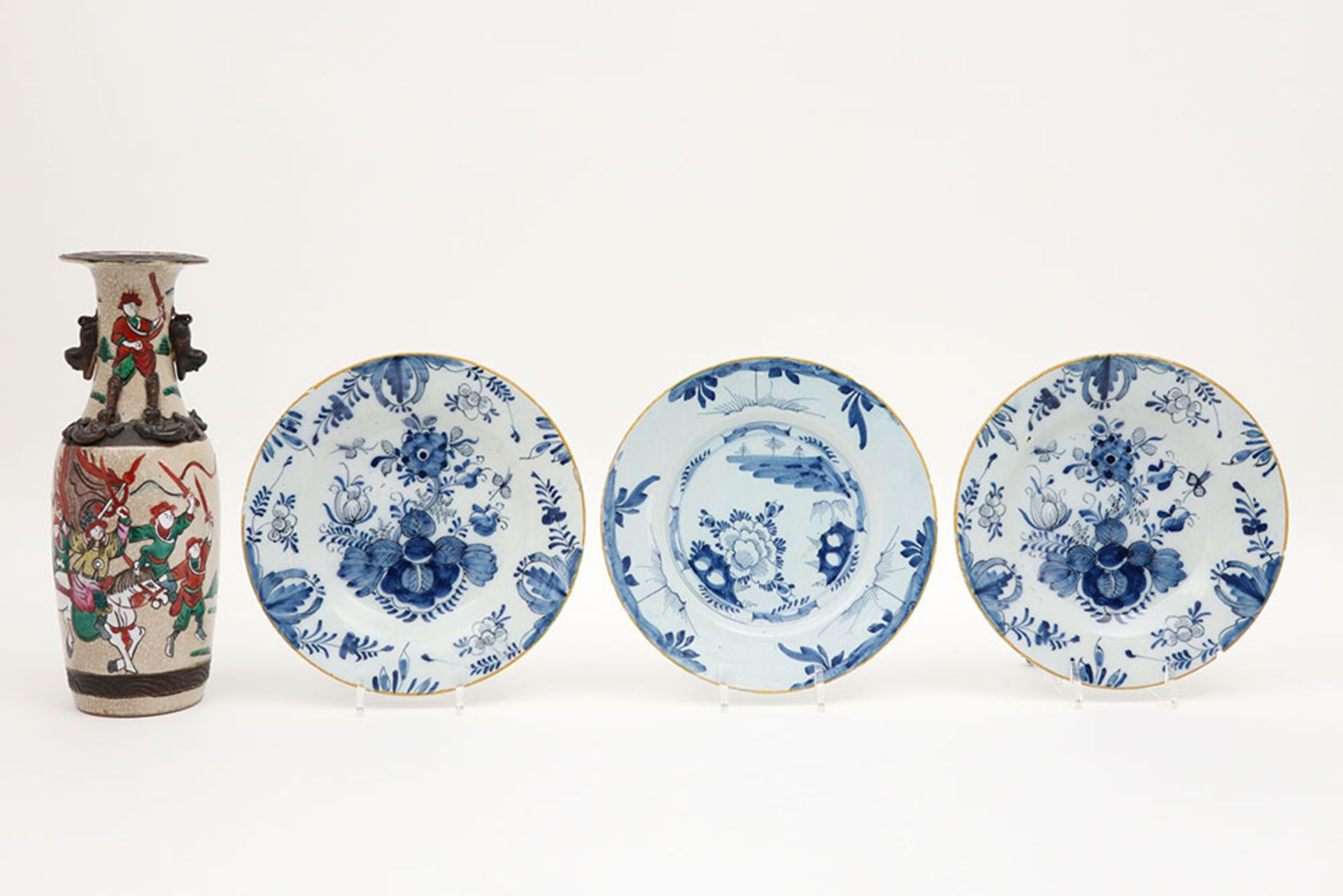 three 18th Cent. plates in ceramic from Delft with a blue-white decor and a Chinese vase in