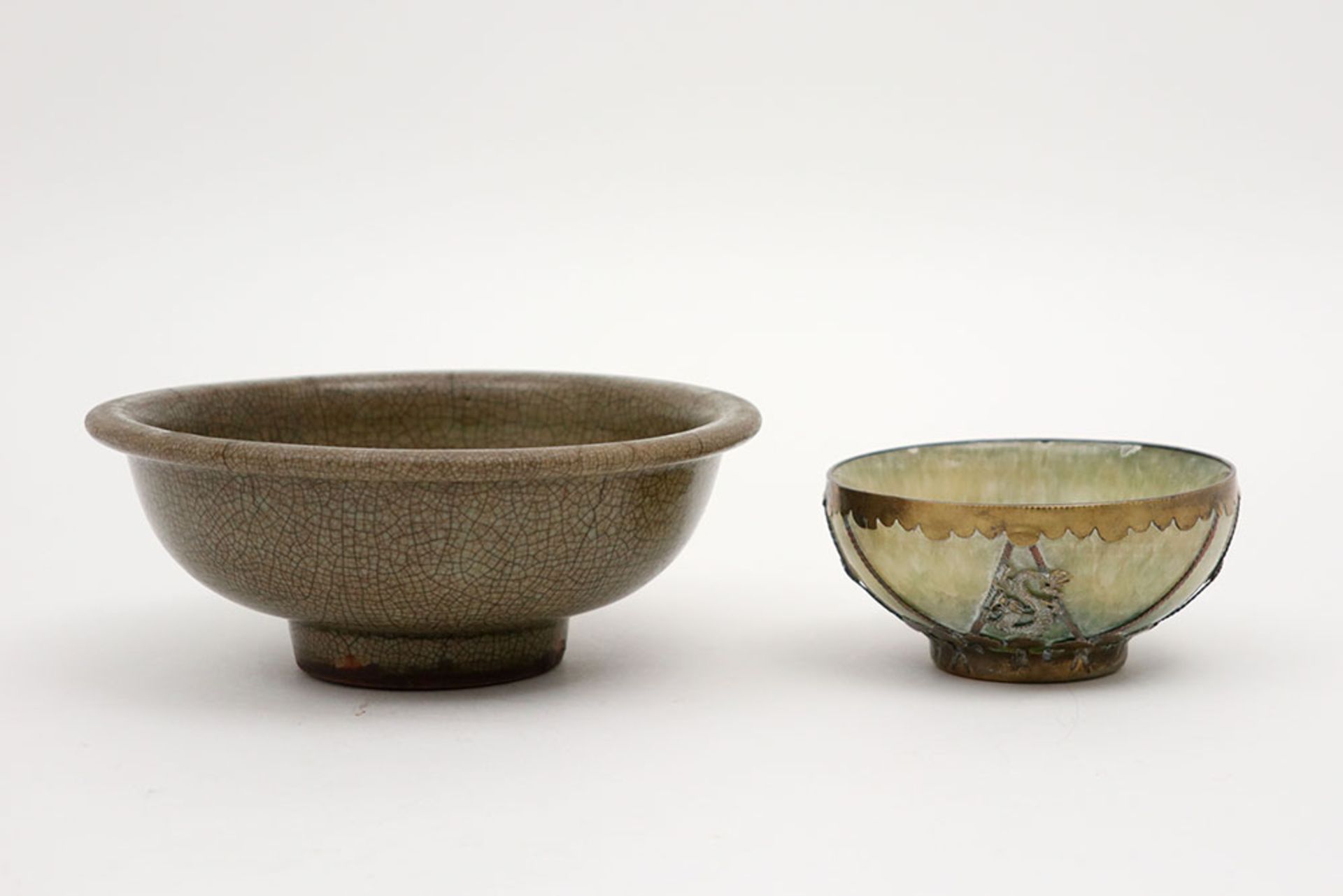 antique Chinese bowl in crackle glazed porcelain and a small Chinese marked bowl in a greenish stone