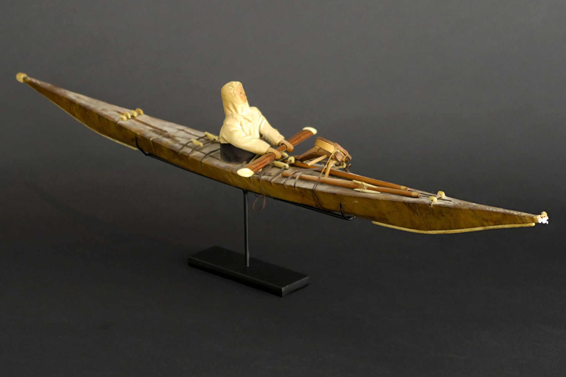 two antique Greenland Inuit model kayaks in wood covered with seal skin - with a doll wearing a - Image 3 of 5