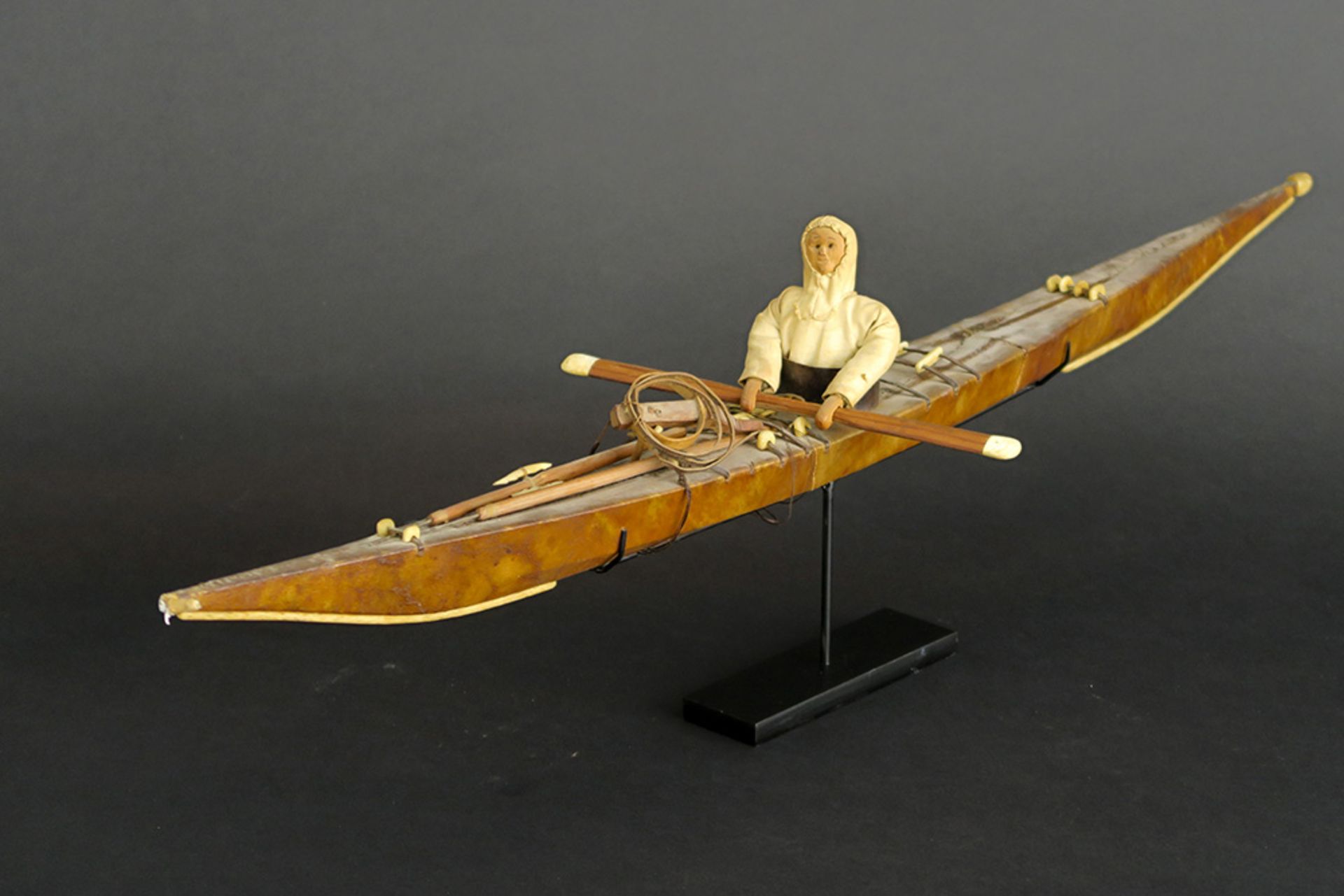 two antique Greenland Inuit model kayaks in wood covered with seal skin - with a doll wearing a - Image 2 of 5