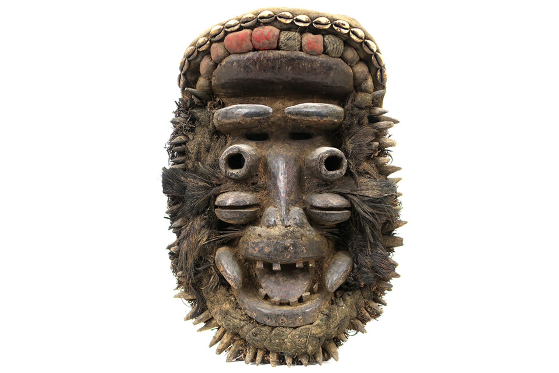 mid 20th Cent. Ivory Coast Guere mask in wood with shells, feathers, cotton, etc || AFRIKA /