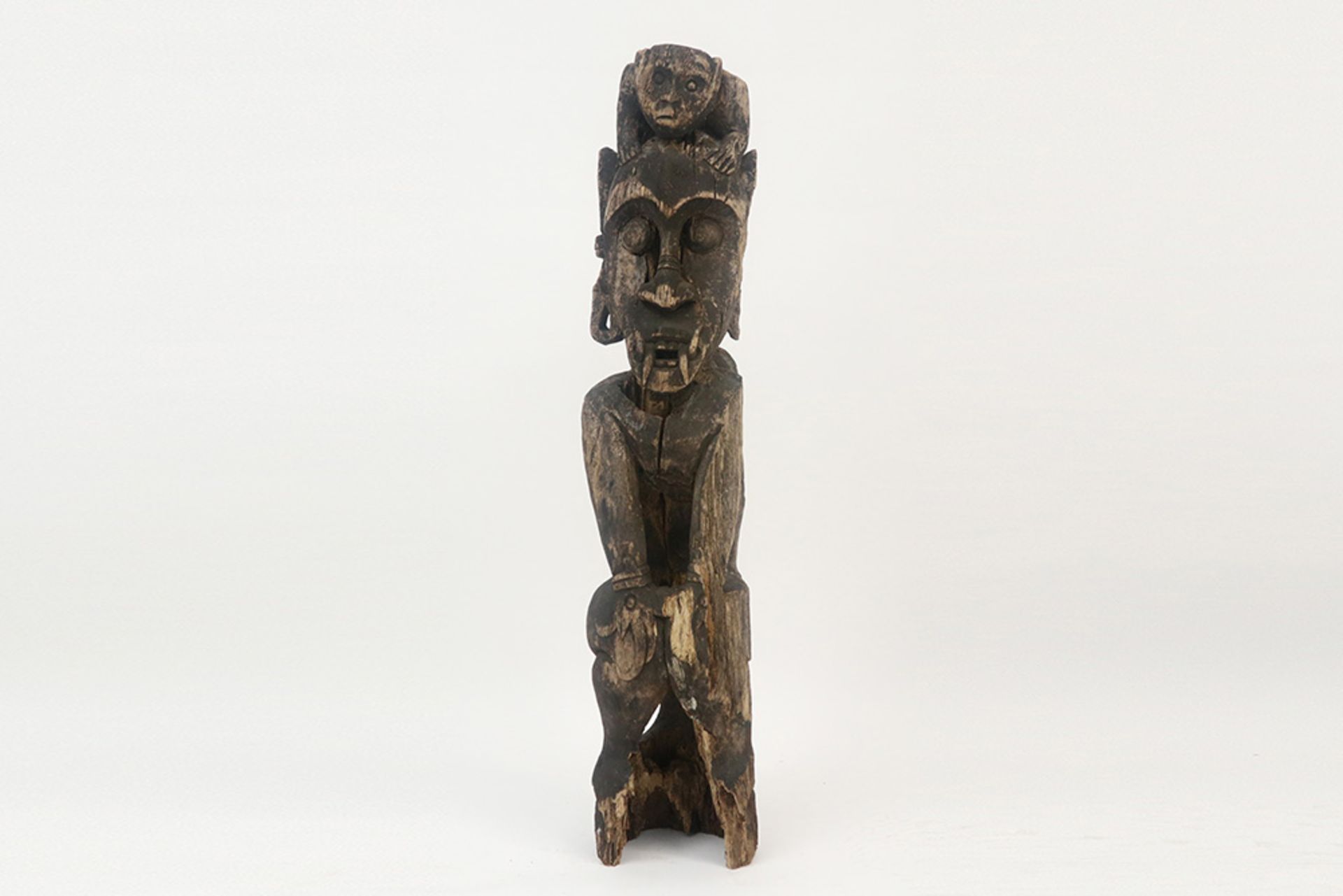 original Bahau Dayak sculpture in wood with the represenstation of a mythical figure with an