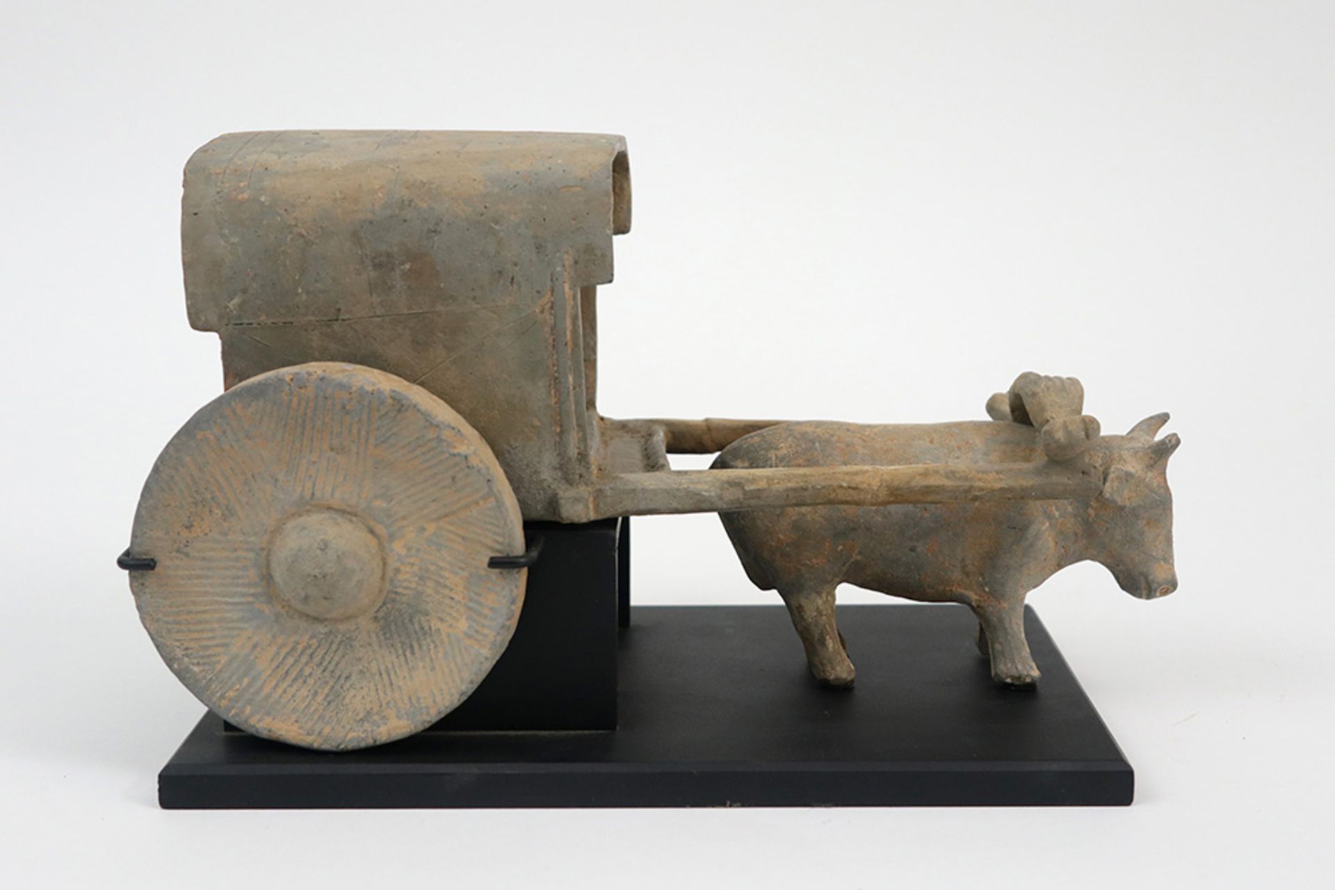Chinese Han period tomb find : a sculpture in earthenware depicting a carriage with two wheels