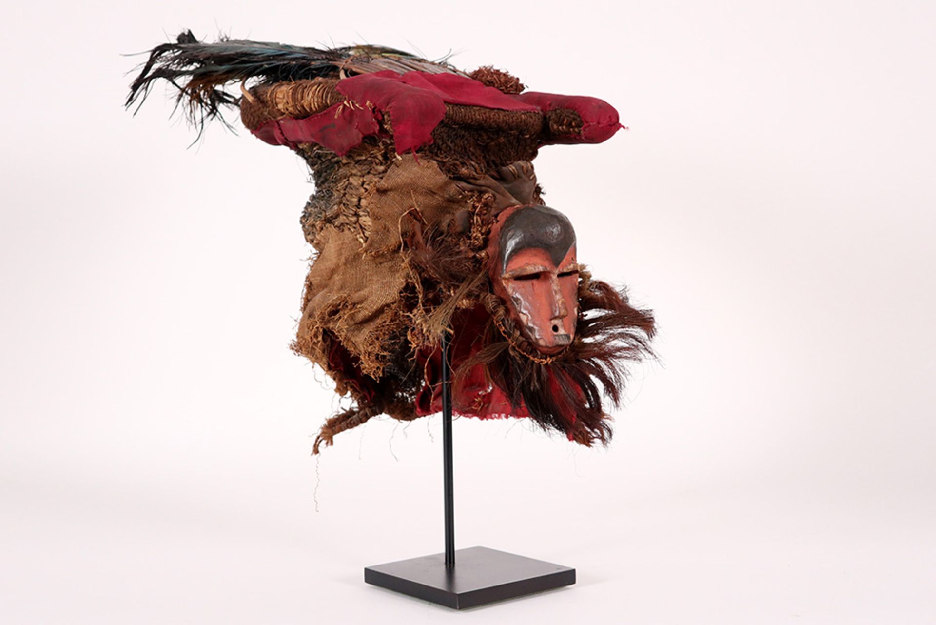 Congolese Badundu/Kasai Pende mask in vegetal fibres, feathers and painted wood with