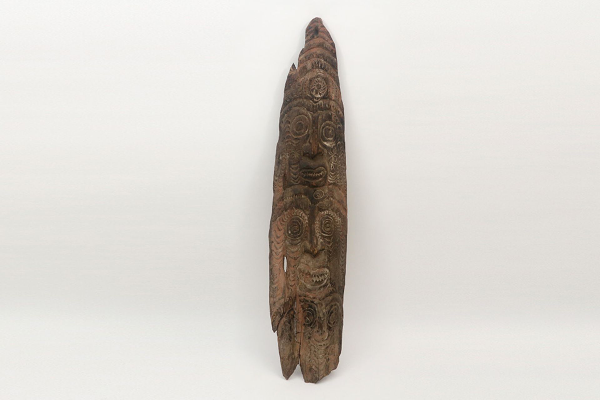 Papua New Guinean Latmul ancestral sculpture in wood with several carved faces || PAPOEASIE