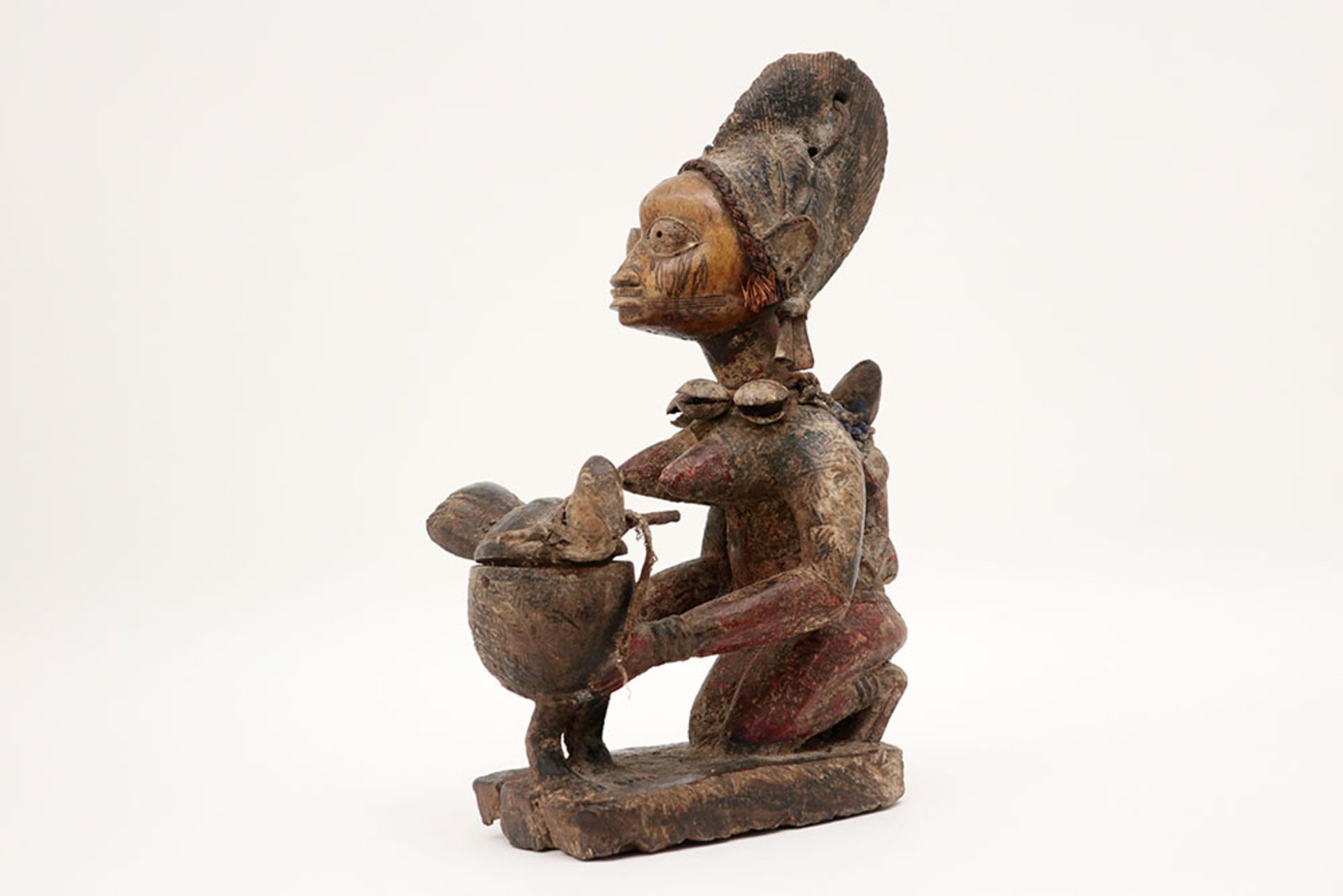 Nigerian Yorouba "Ekiti Efon-Alaye"-sculpture in wood, textile, raffia, metal with remains of