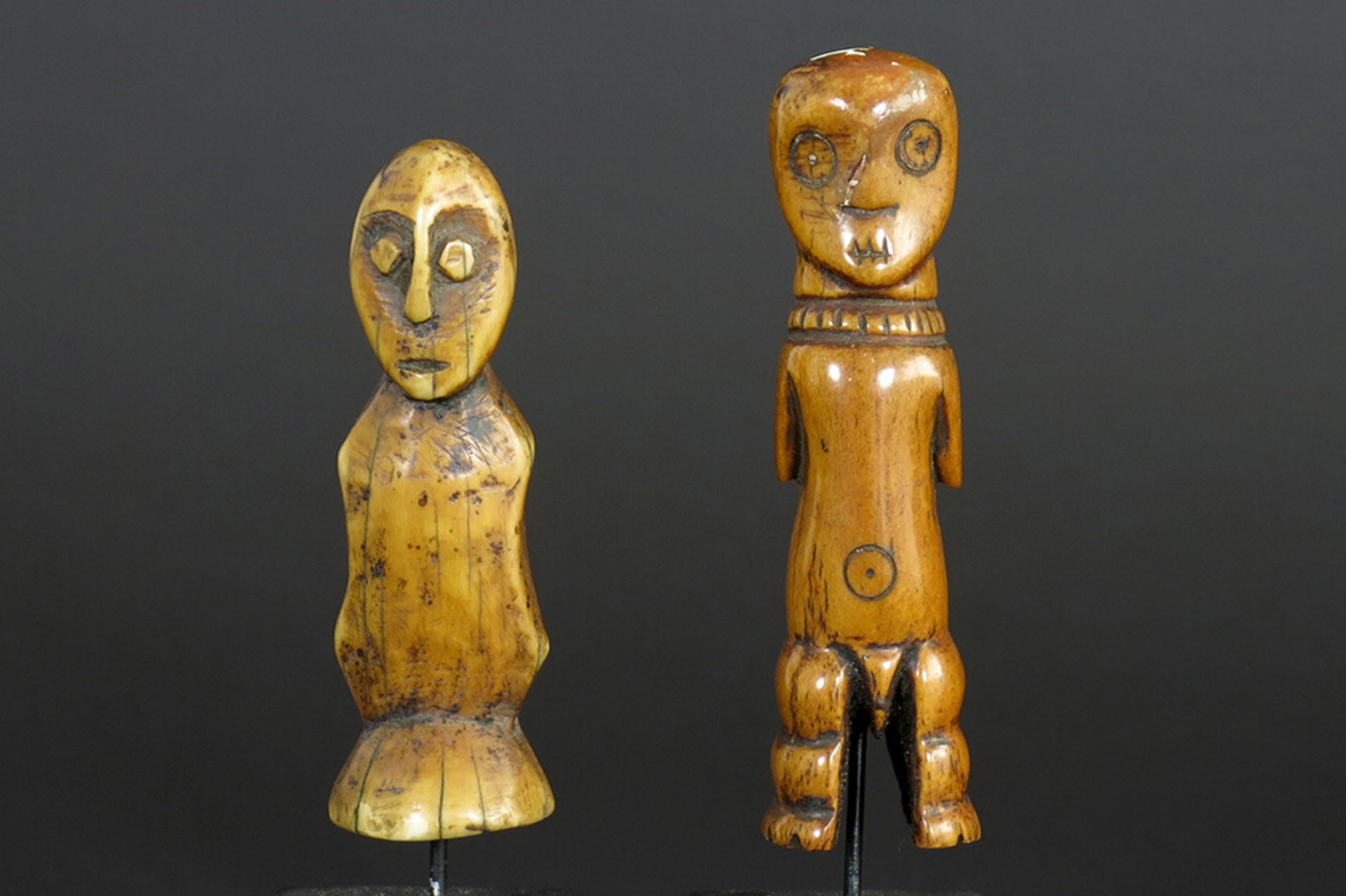two African Congolese 'Lega' human figure sculptures in ivory with nice patina - one is the head