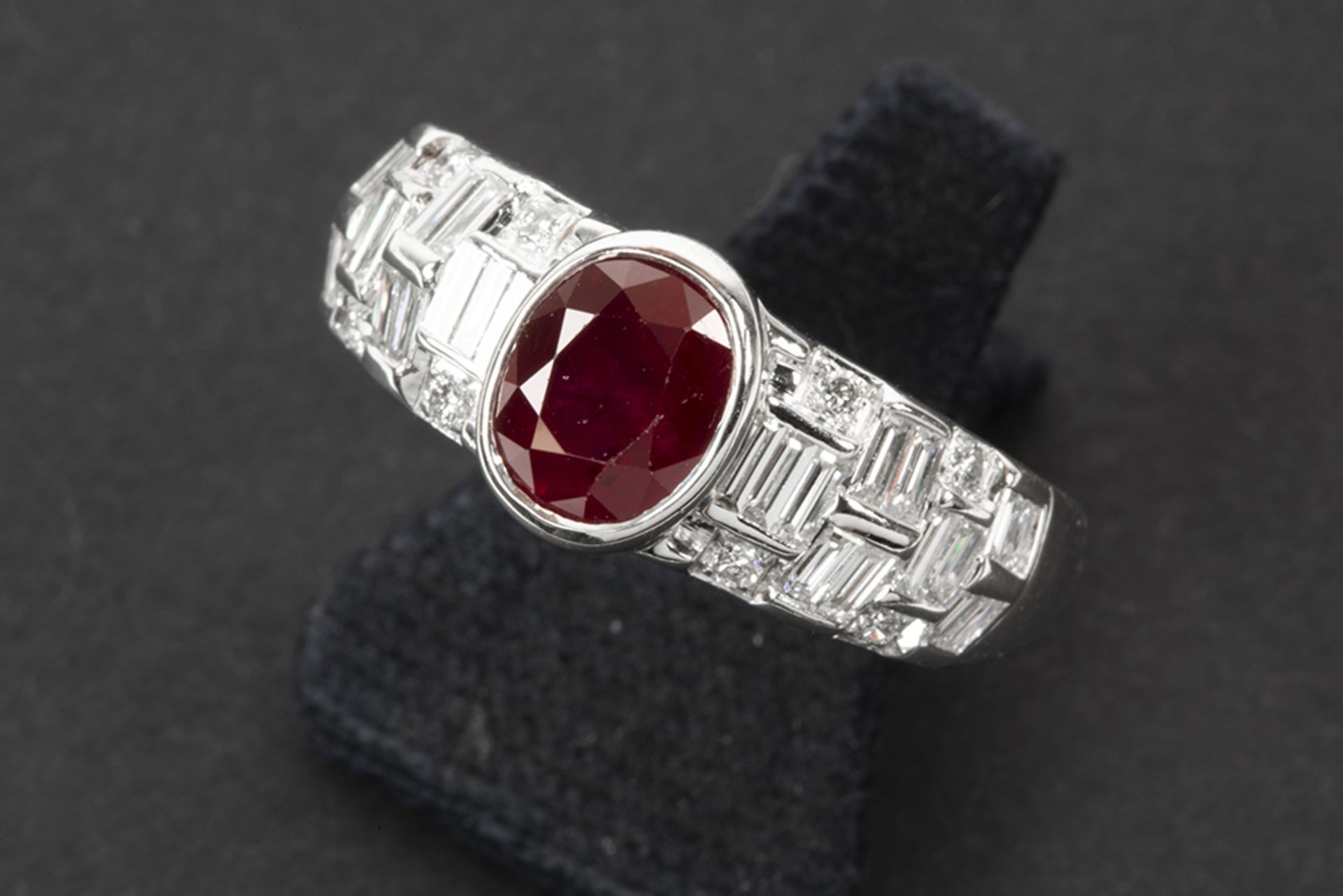 a 1,71 carat not heated Burmese ruby set in a ring in white gold (18 carat) with ca 0,65 carat of