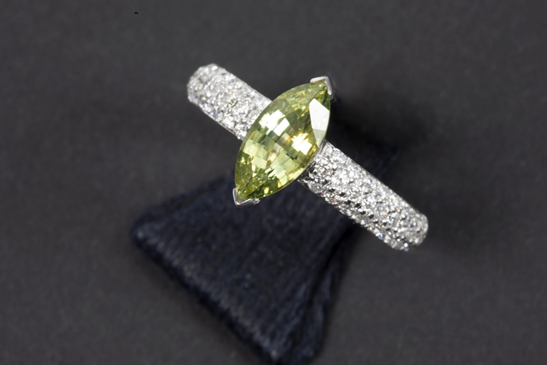 ring in white gold (18 carat) with a 1,35 carat sapphire with quite rare green color and ca 0,70