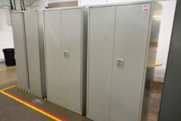 Three 2 door steel storage cabinets