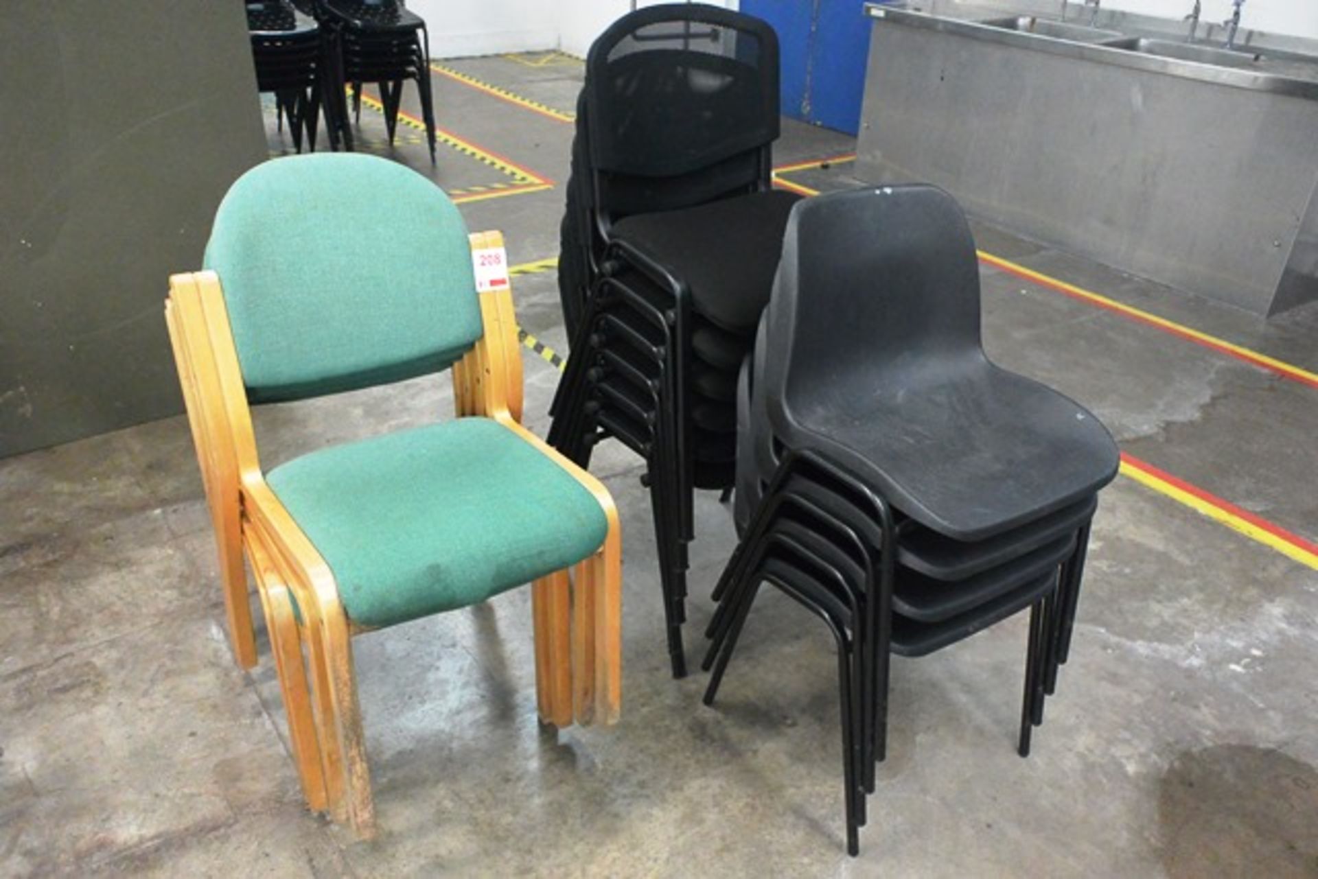 Fourteen various stacking chairs