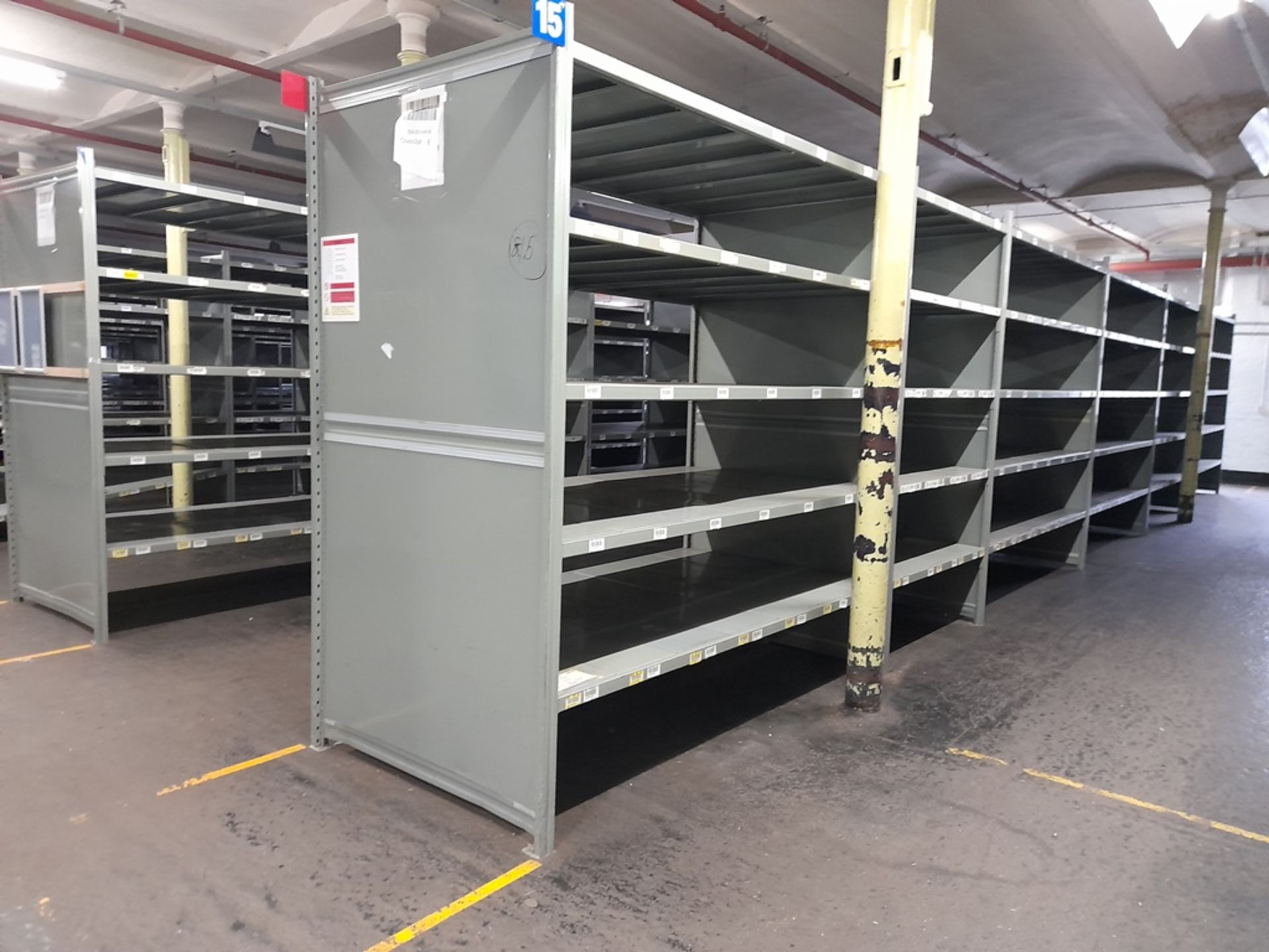 Heavy duty metal storage shelving - 144 bays, each with 5 pairs of beams and 35 metal shelf