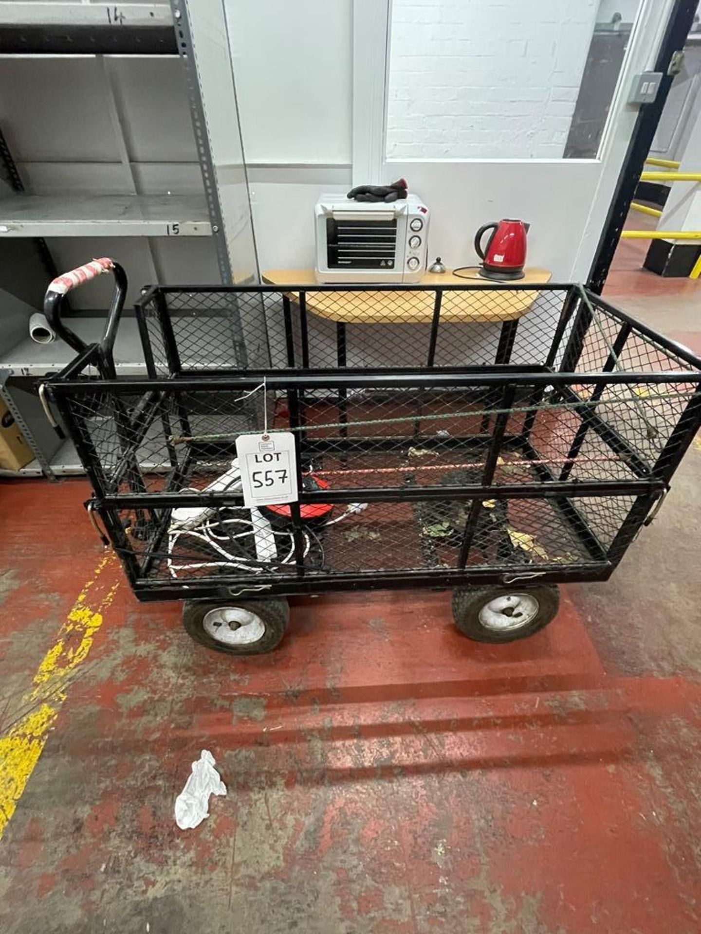 Four wheel pneumatic truck, with drop caged sides