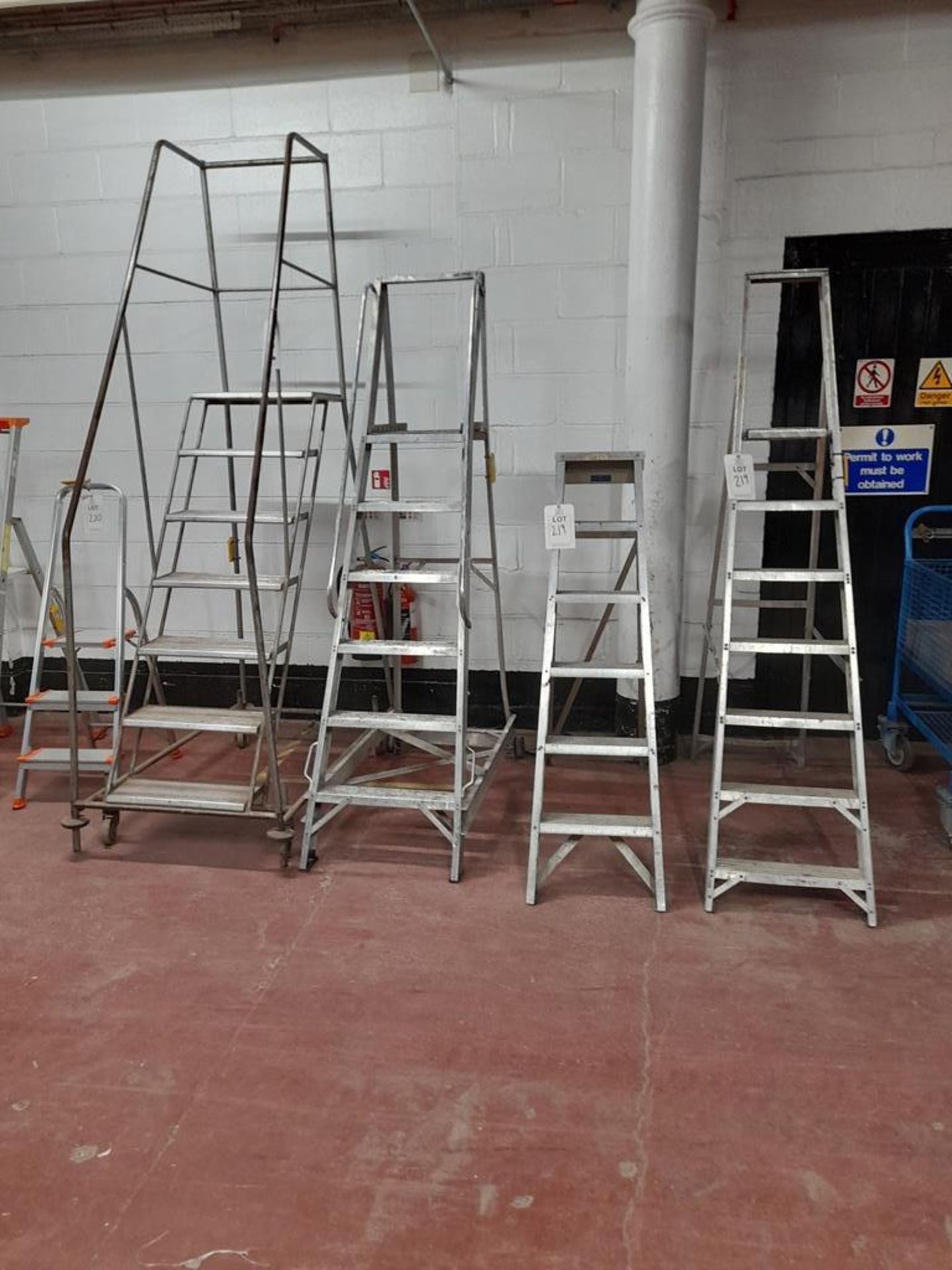 1 - 7-tread warehouse steps, 1 - 6-tread warehouse steps, 1 - 7-tread step ladder an 1 - 6 tread