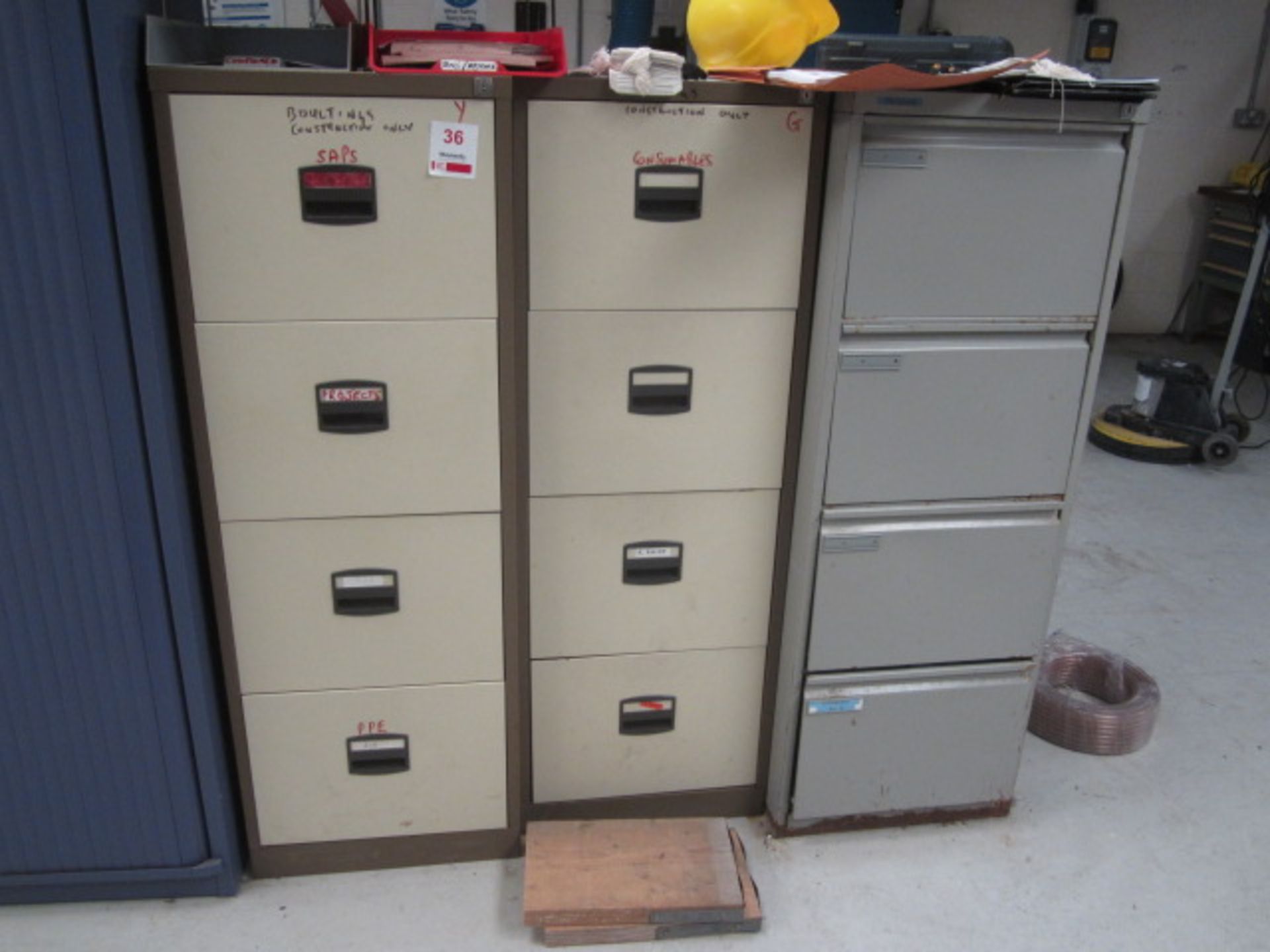 Eight assorted 4 drawer filing cabinets