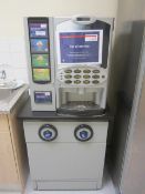 Crane Merchandising Systems hot drinks machine, model V4, mounted on lockable cabinet with two cup