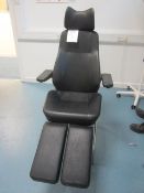 Leatherette examination chair with manual reclining back, adjustable leg rests