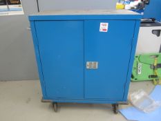 Steel 2 door mobile storage cabinet with various assorted reeled gaskets, etc.