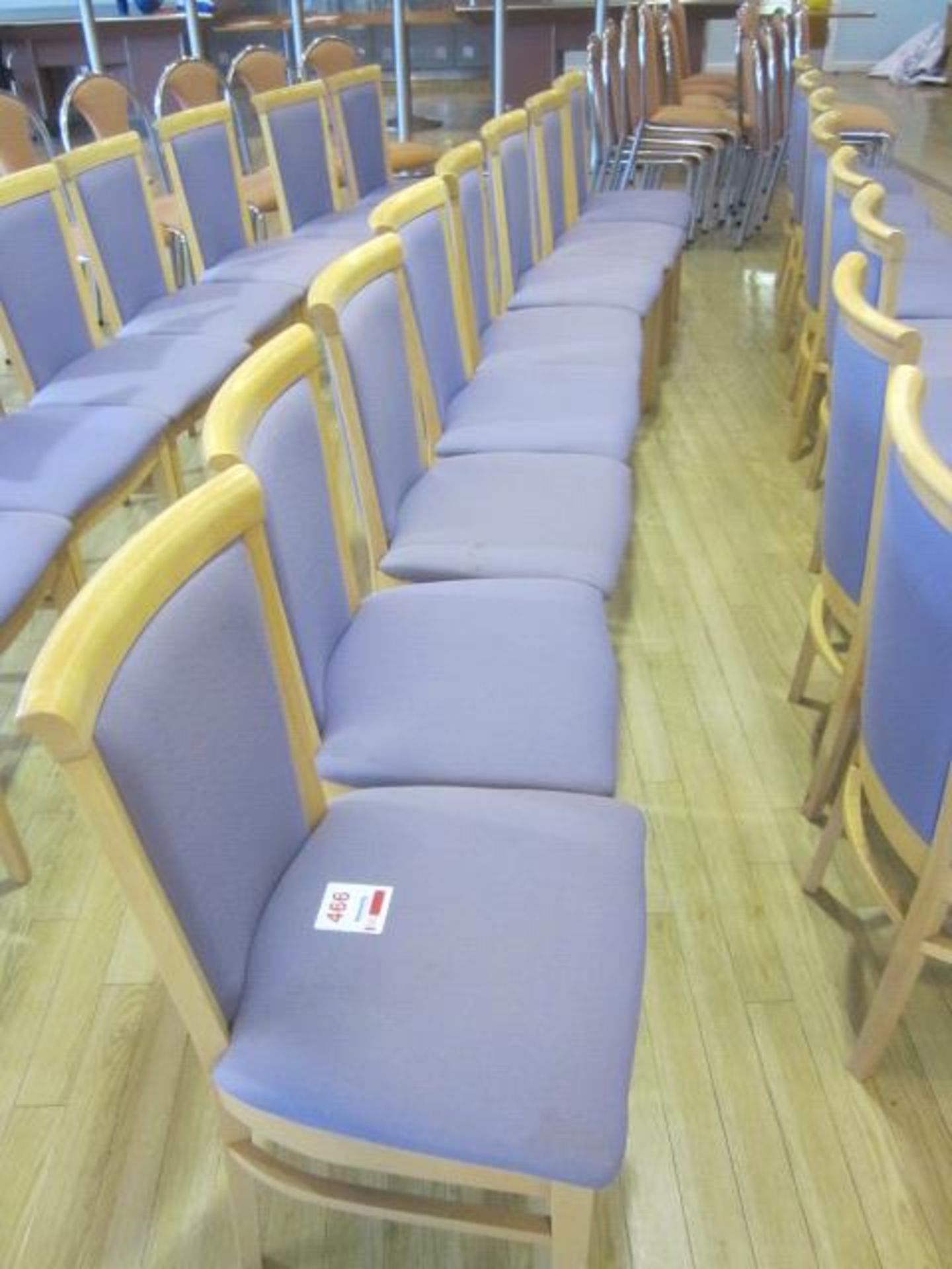 Eight wood framed purple upholstered seat/back canteen chairs