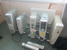 Five assorted mobile space heaters and two Legrand 4 socket extension leads