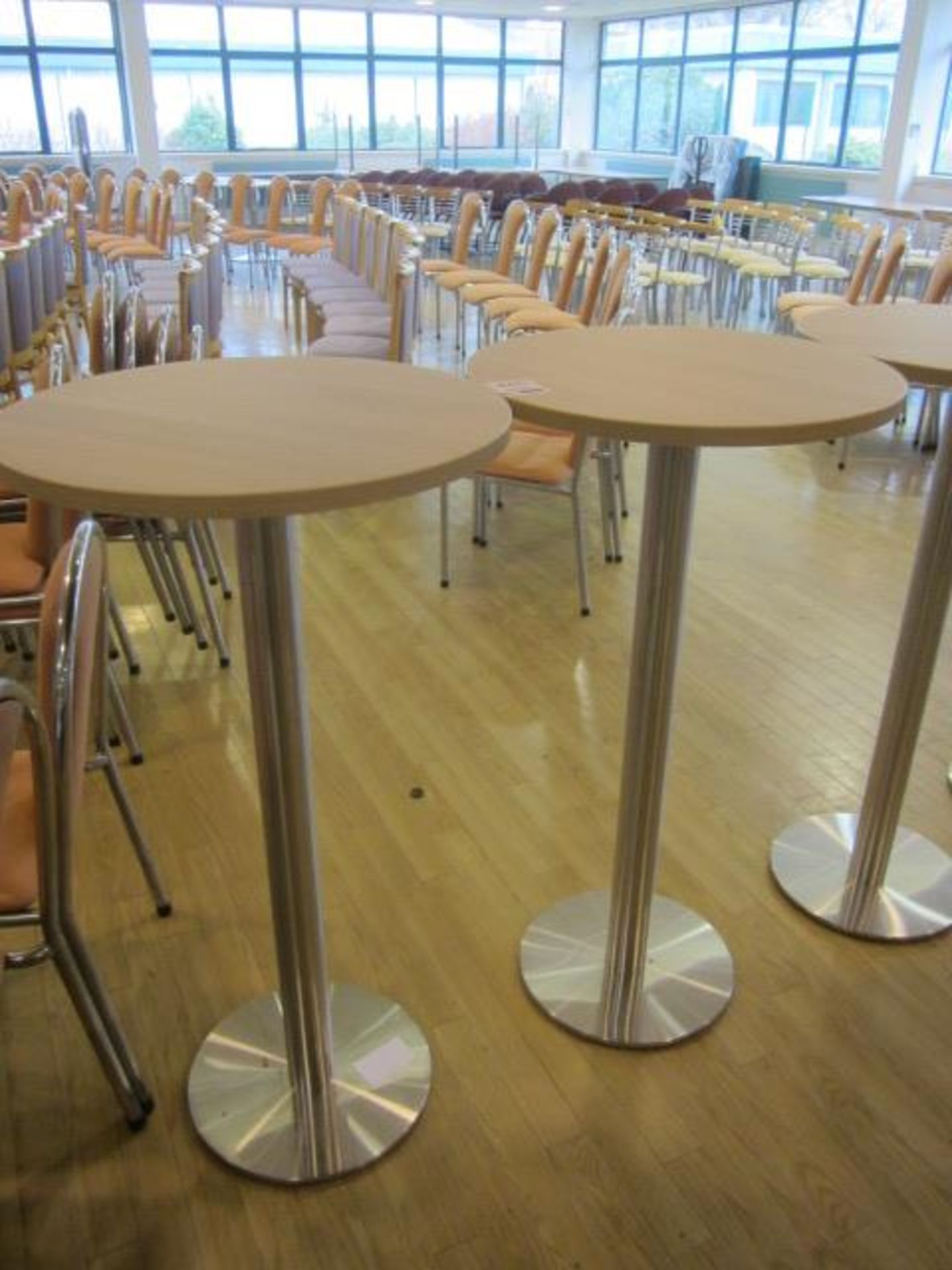 Two wood effect circular high canteen tables, 600mm dia