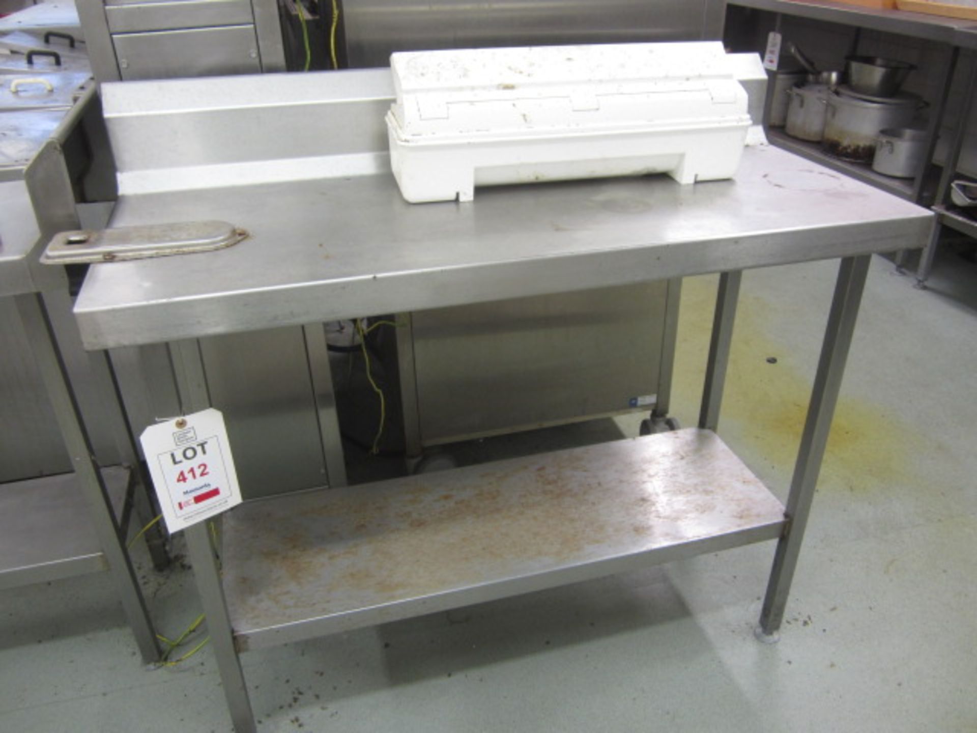 Two stainless steel preparation table with splash back, undershelf 1130mm x 500mm