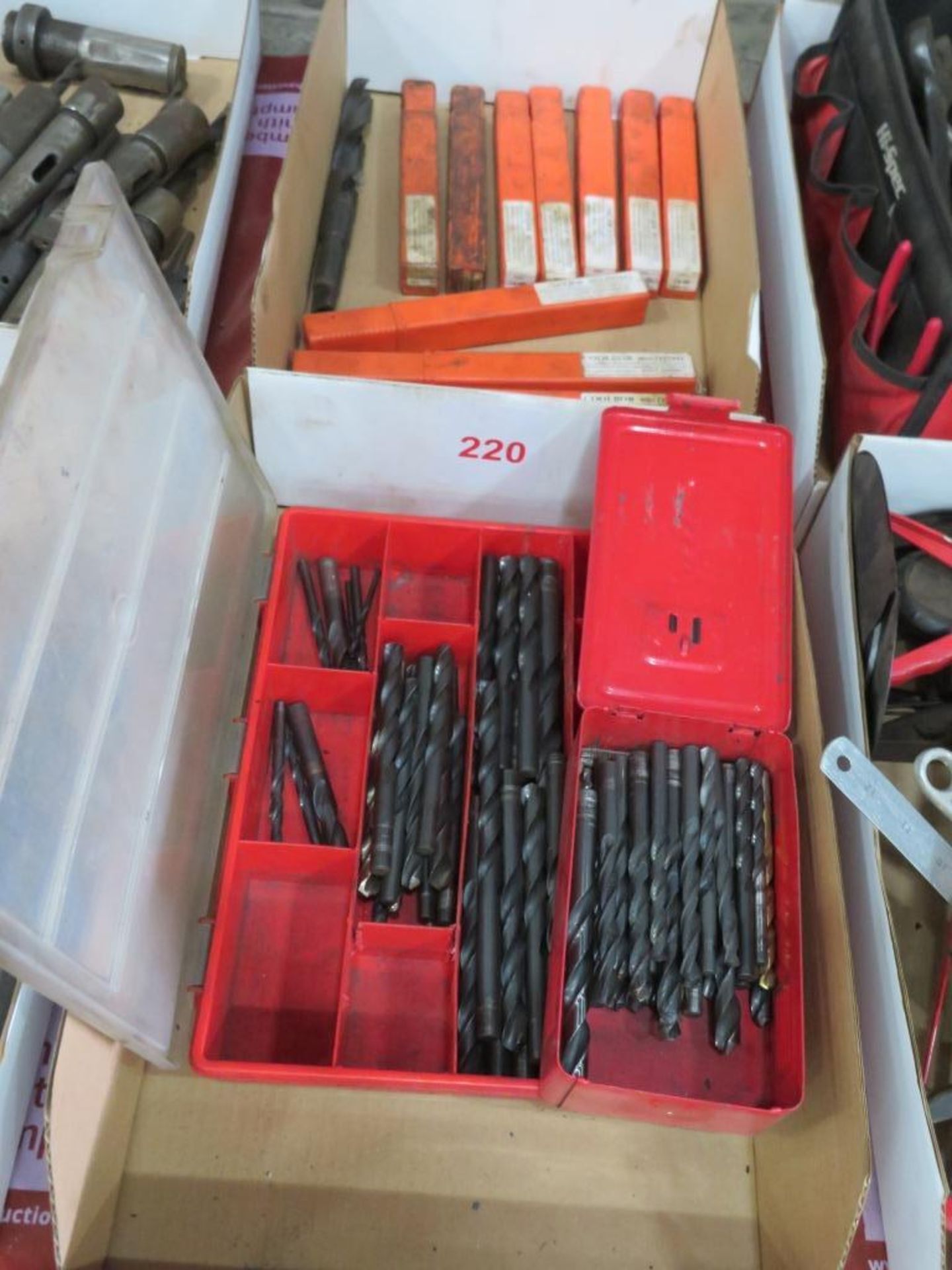 Drill bits in two tote bins