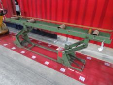 A steel height adjustable roller conveyor 3m long