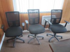 Three assorted cloth upholstered swivel office chairs, with mesh back