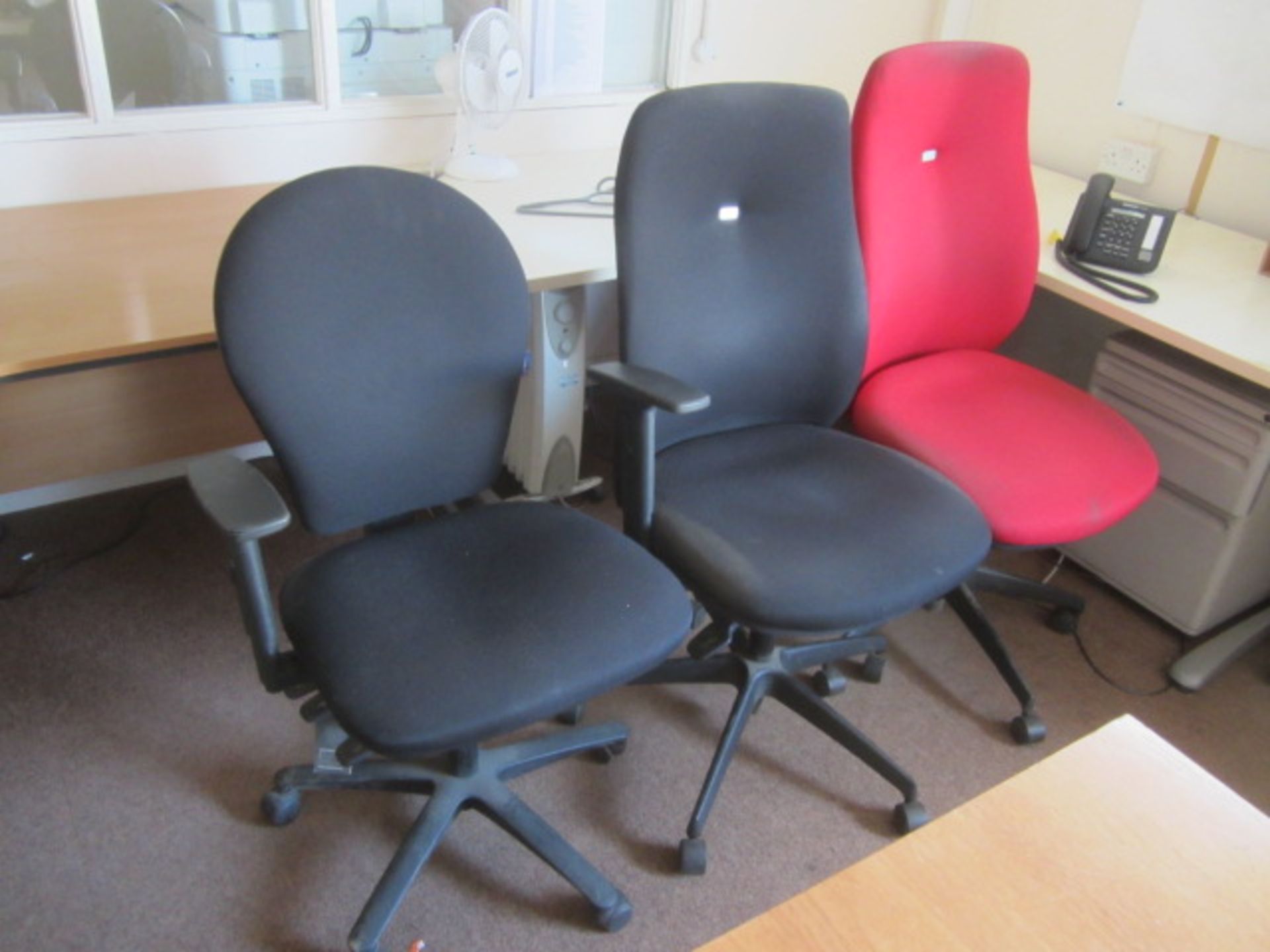 Three assorted cloth upholstered swivel office chairs