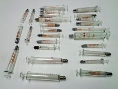 Assorted glass syringes