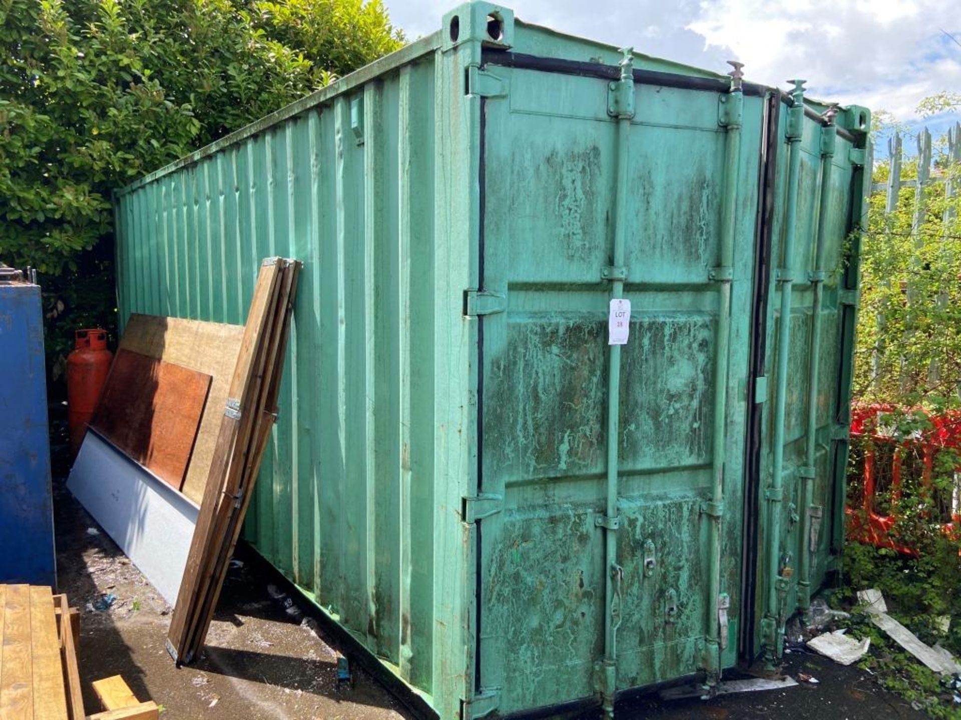20 foot x 8 foot shipping container, plywood floor (contents not included) (Please note a Risk...