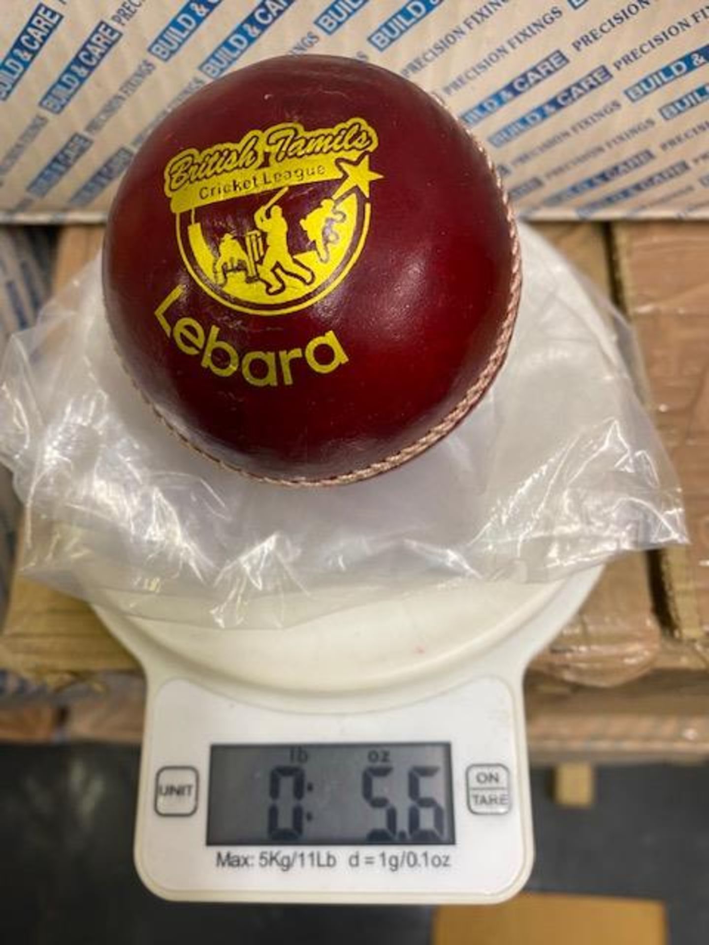 Thirty six Lebara red 5.5oz cricket balls branded with British Tamile cricket league